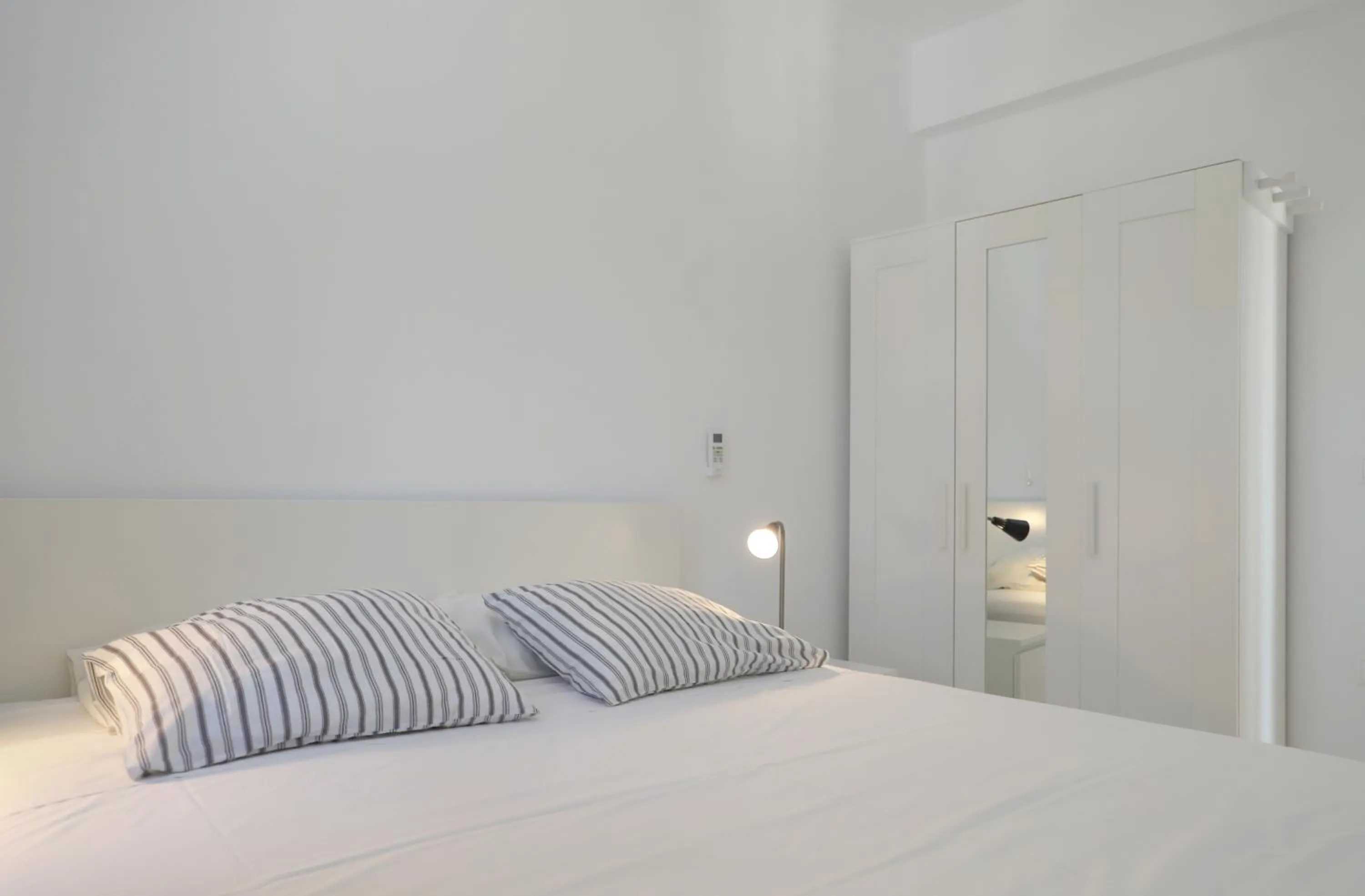 Bed in Helios Studios & Apartments