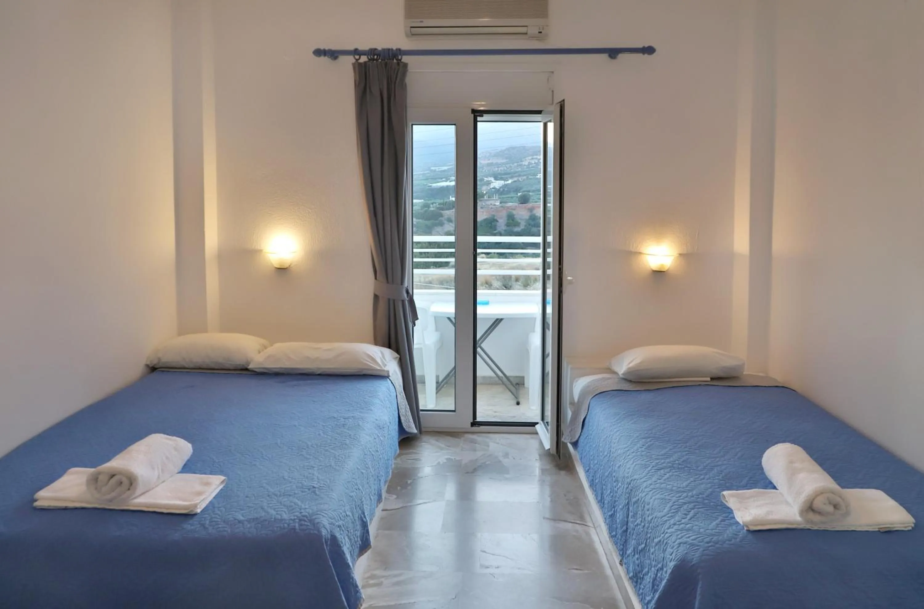 Bed in Helios Studios & Apartments