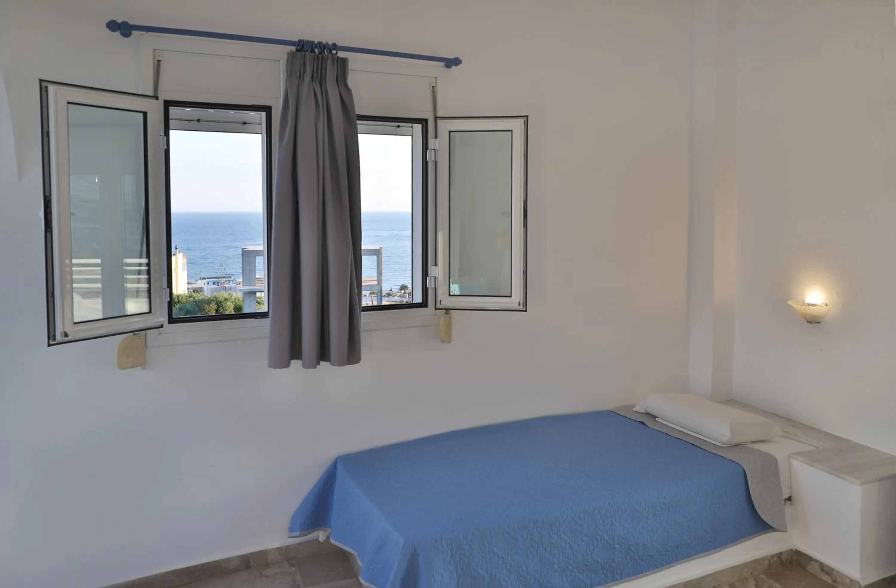 Bed in Helios Studios & Apartments