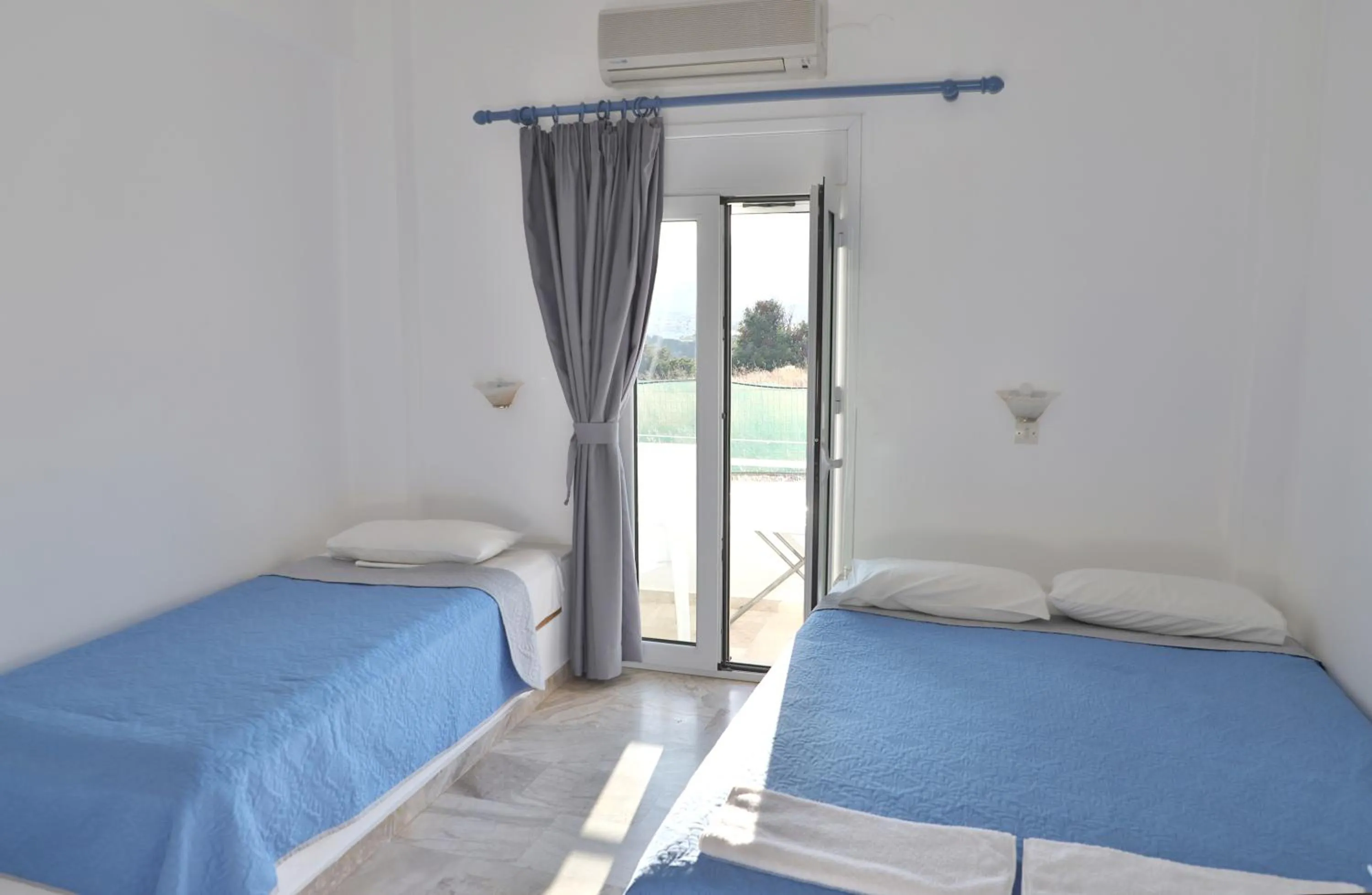 Bed in Helios Studios & Apartments