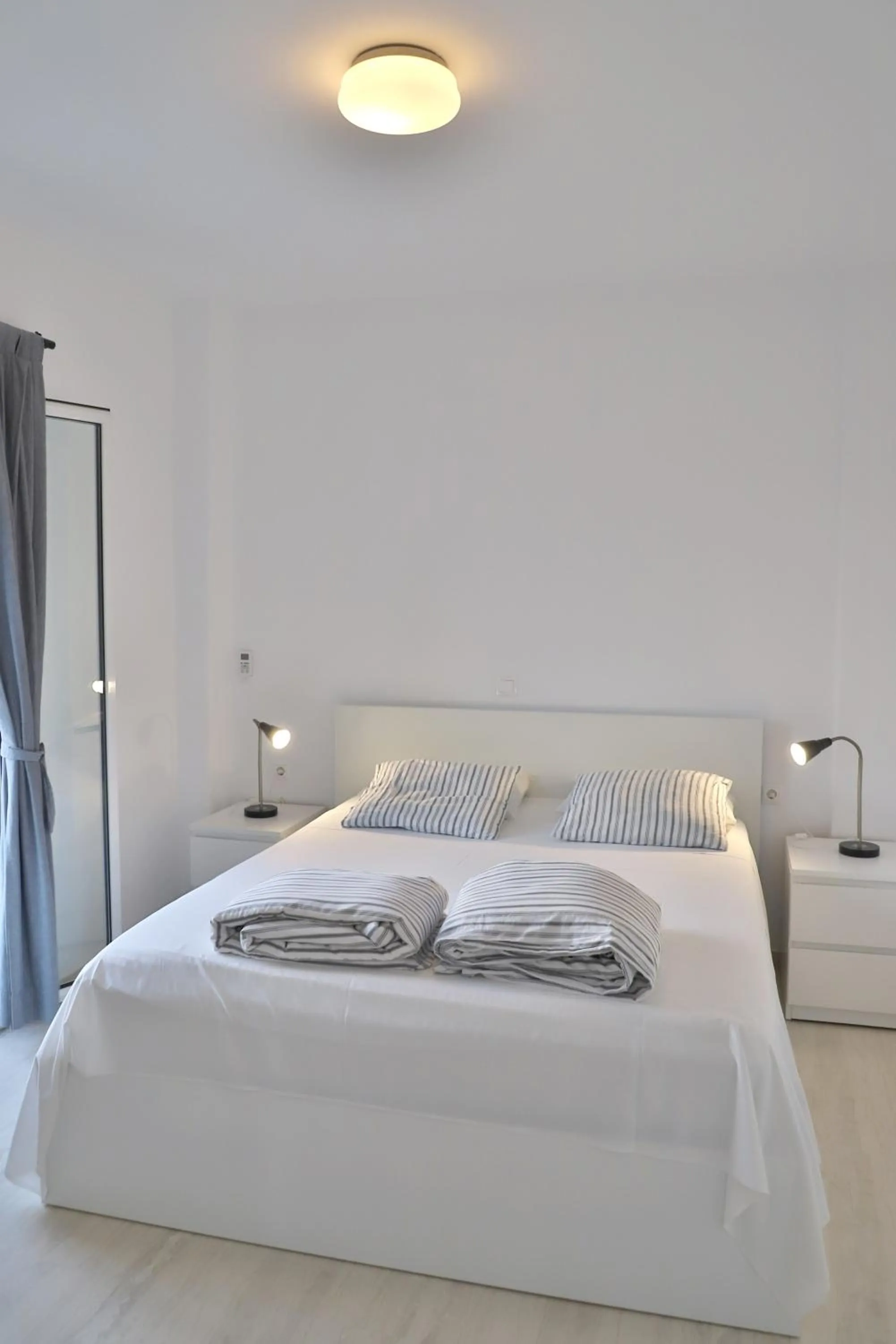 Bed in Helios Studios & Apartments