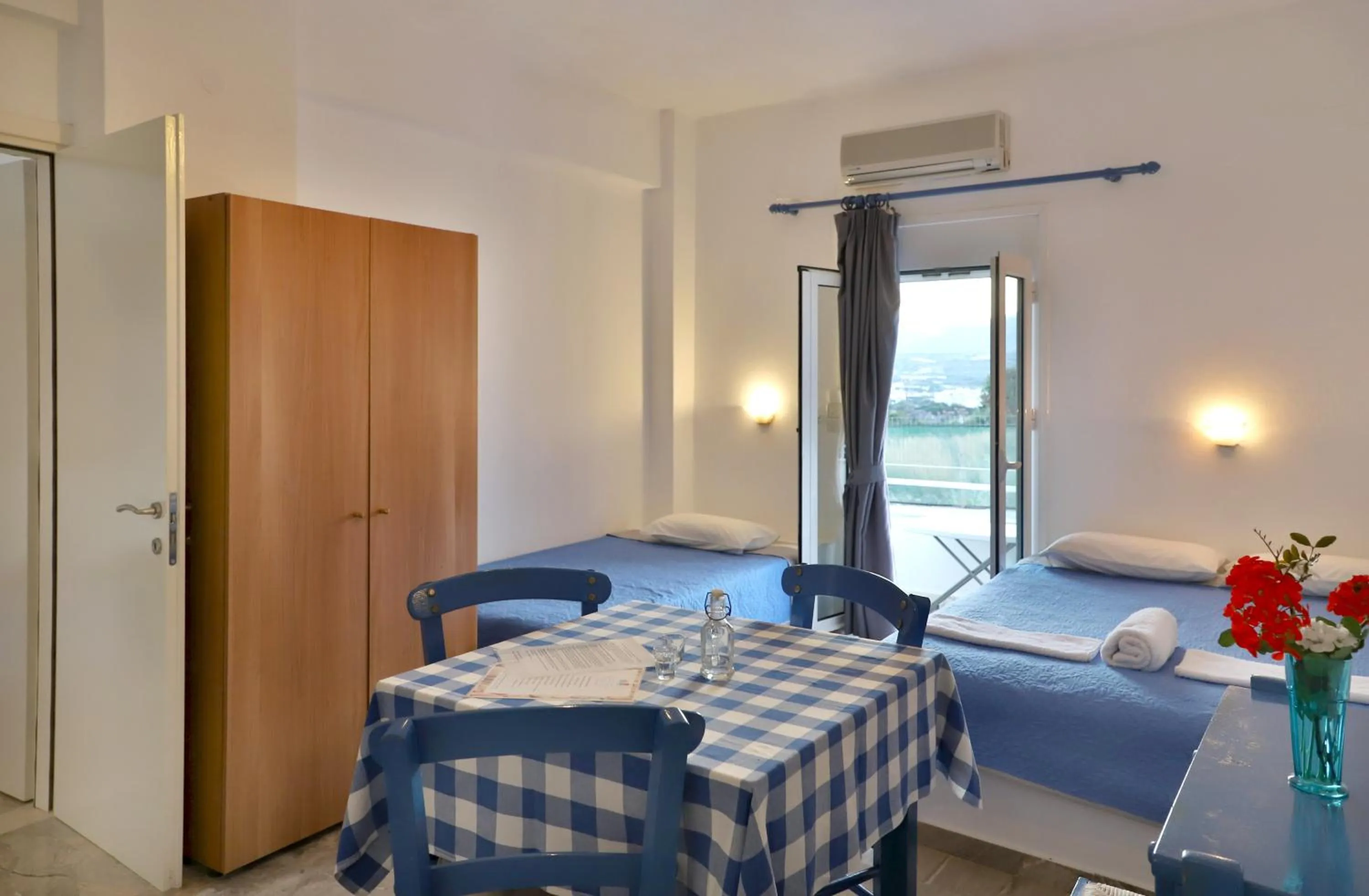 Bed in Helios Studios & Apartments