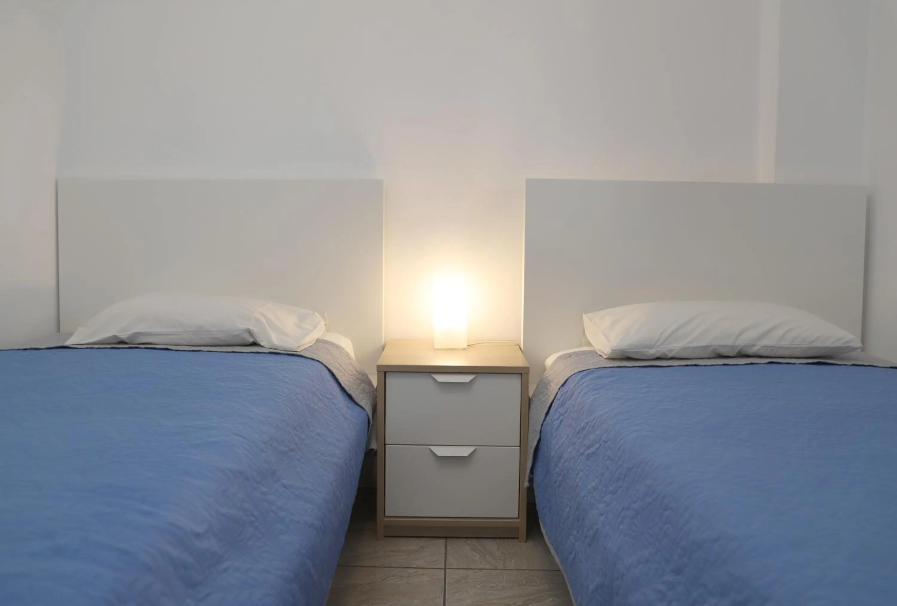 Bed in Helios Studios & Apartments