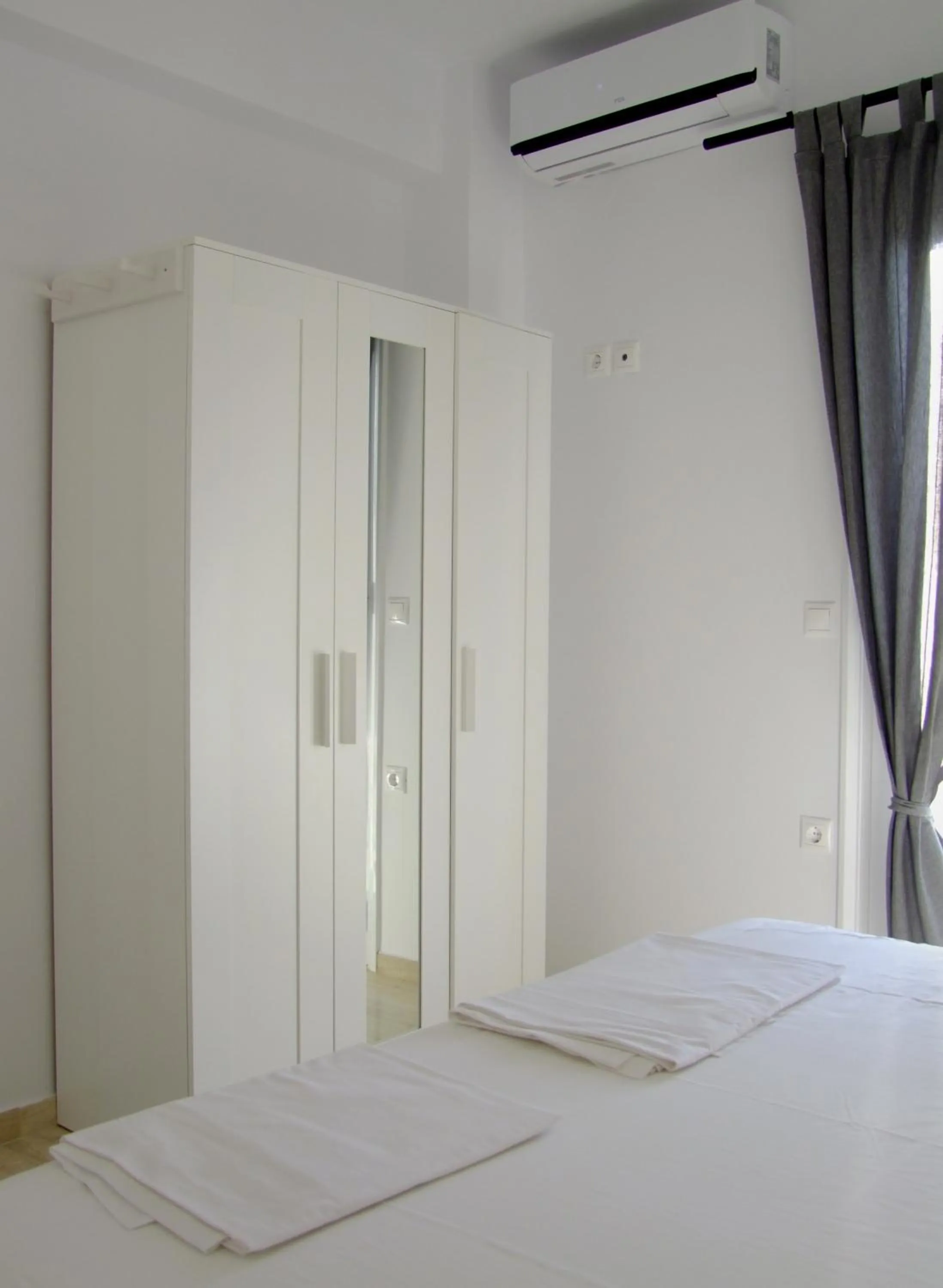 Bed in Helios Studios & Apartments