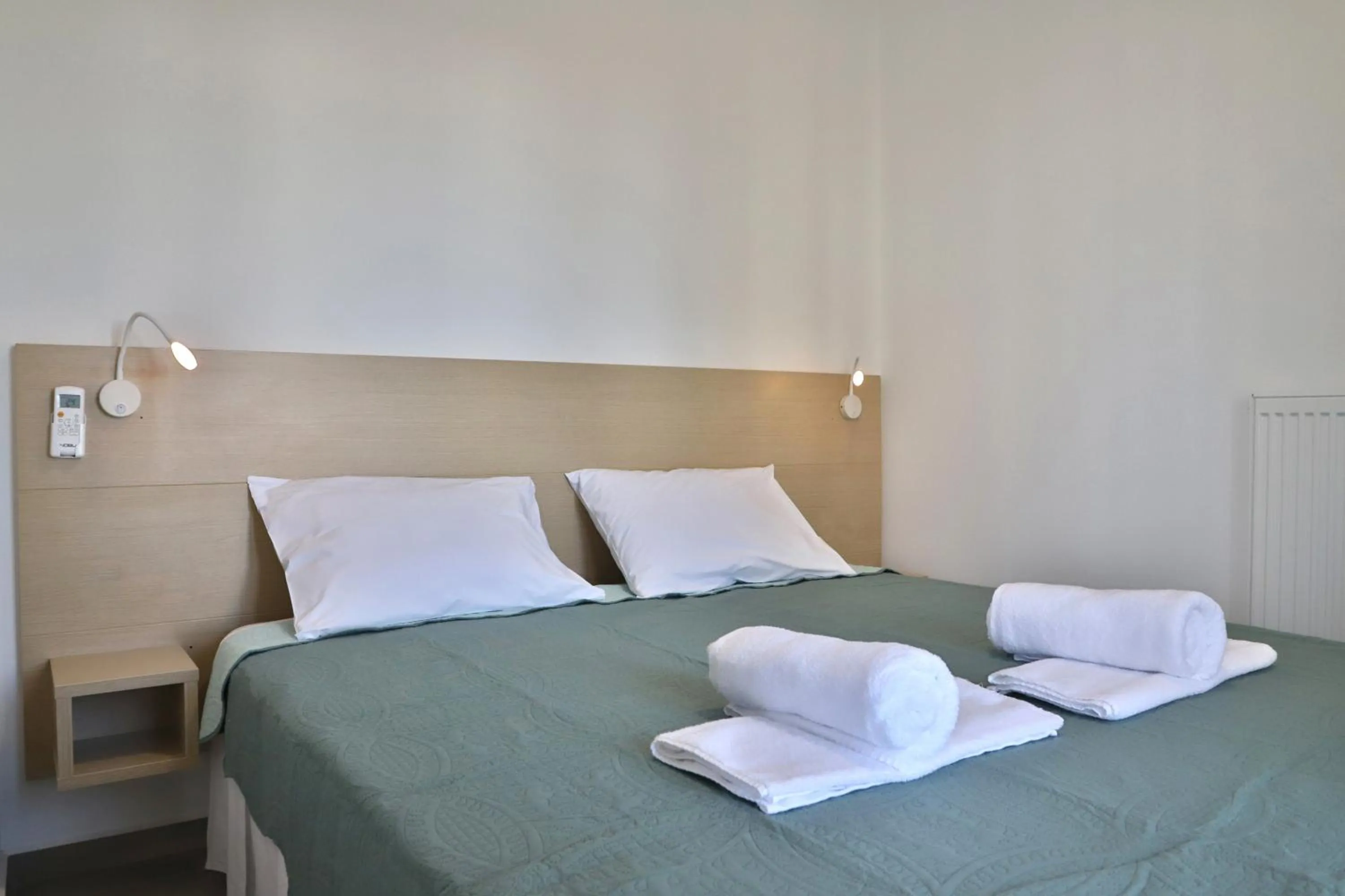 Bed in Helios Studios & Apartments