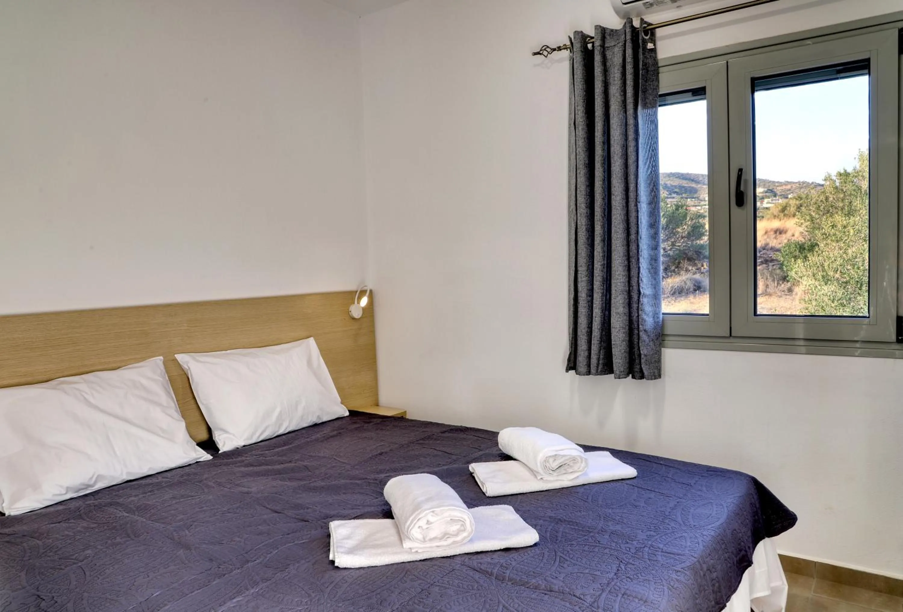 Bed in Helios Studios & Apartments