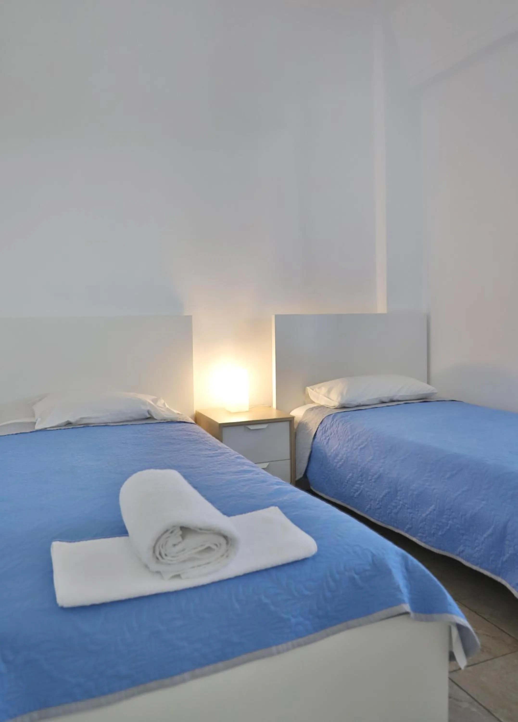 Bed in Helios Studios & Apartments