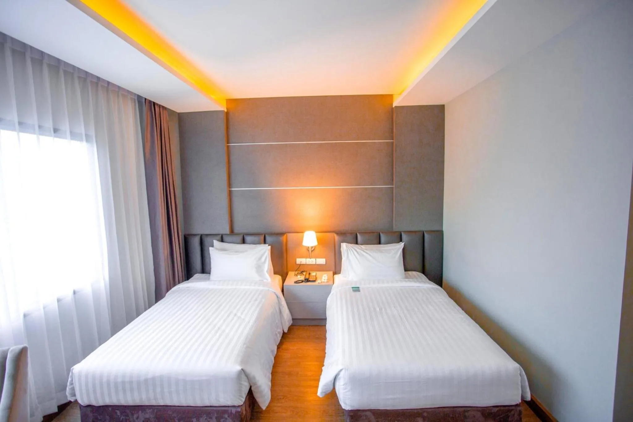 Bed in The Cheewin Hotel And Convention