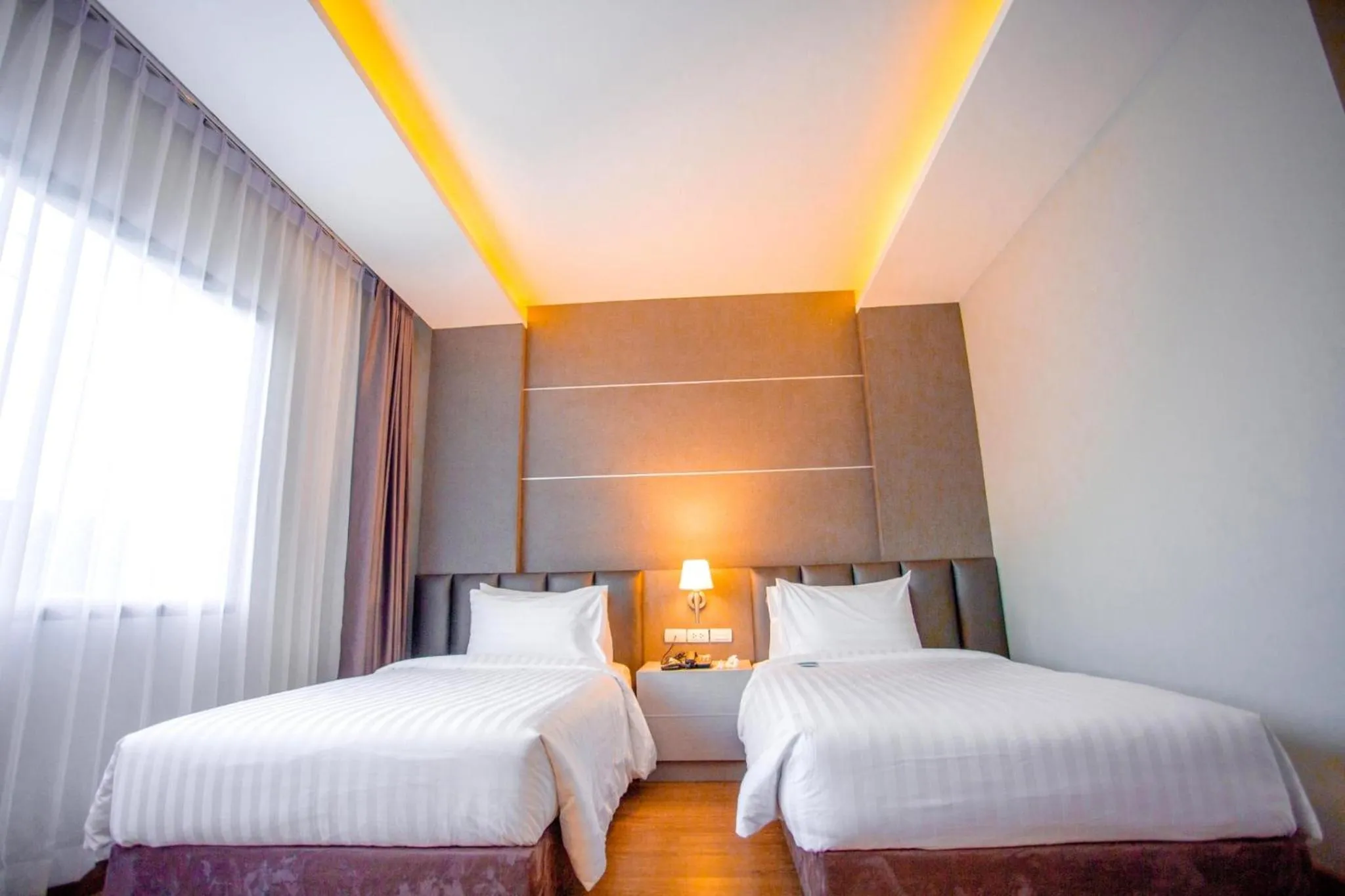 Bed in The Cheewin Hotel And Convention