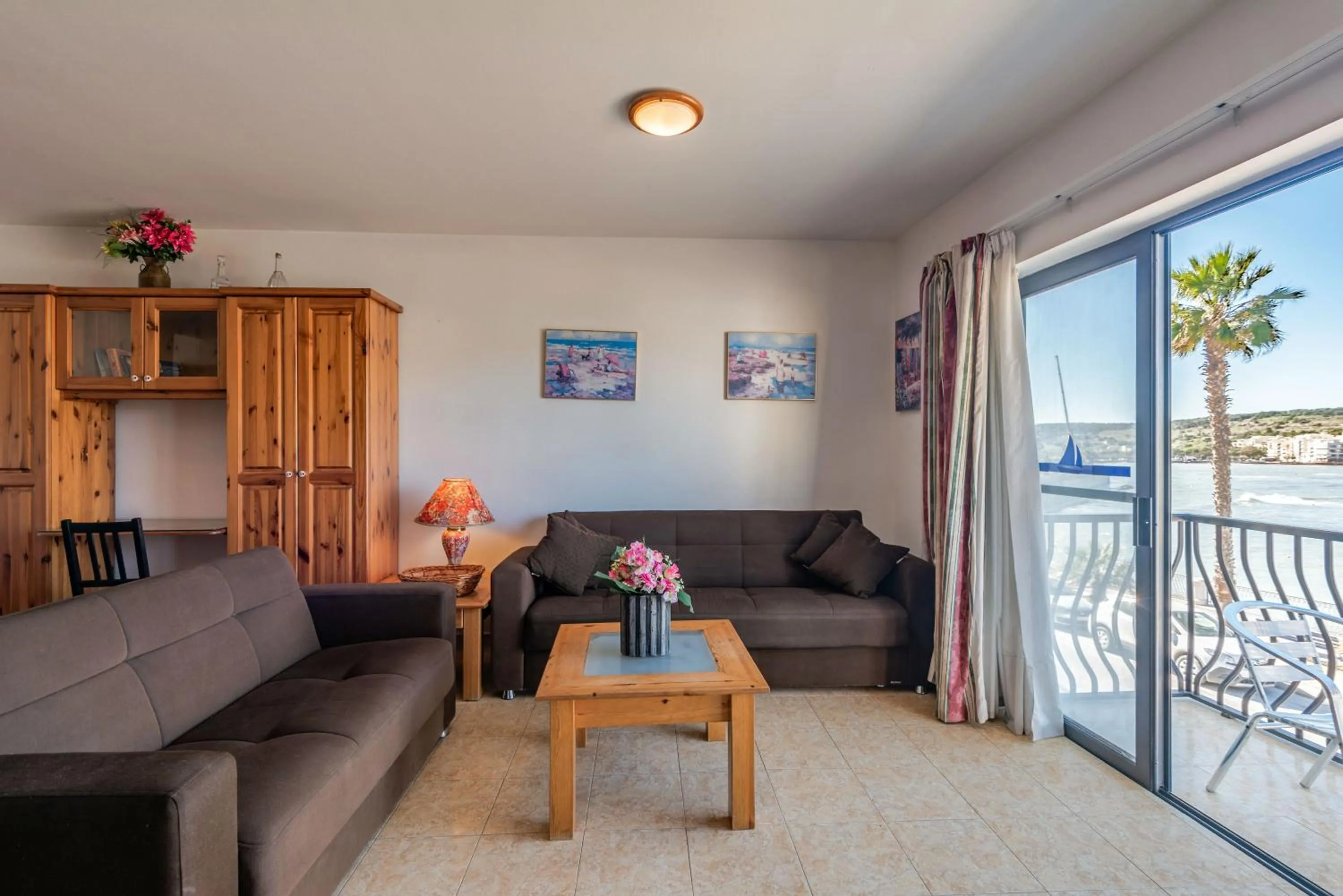 Living room in Harbour Lights seafront 2 bedroom apartments with panoramic sea views - by Getawaysmalta