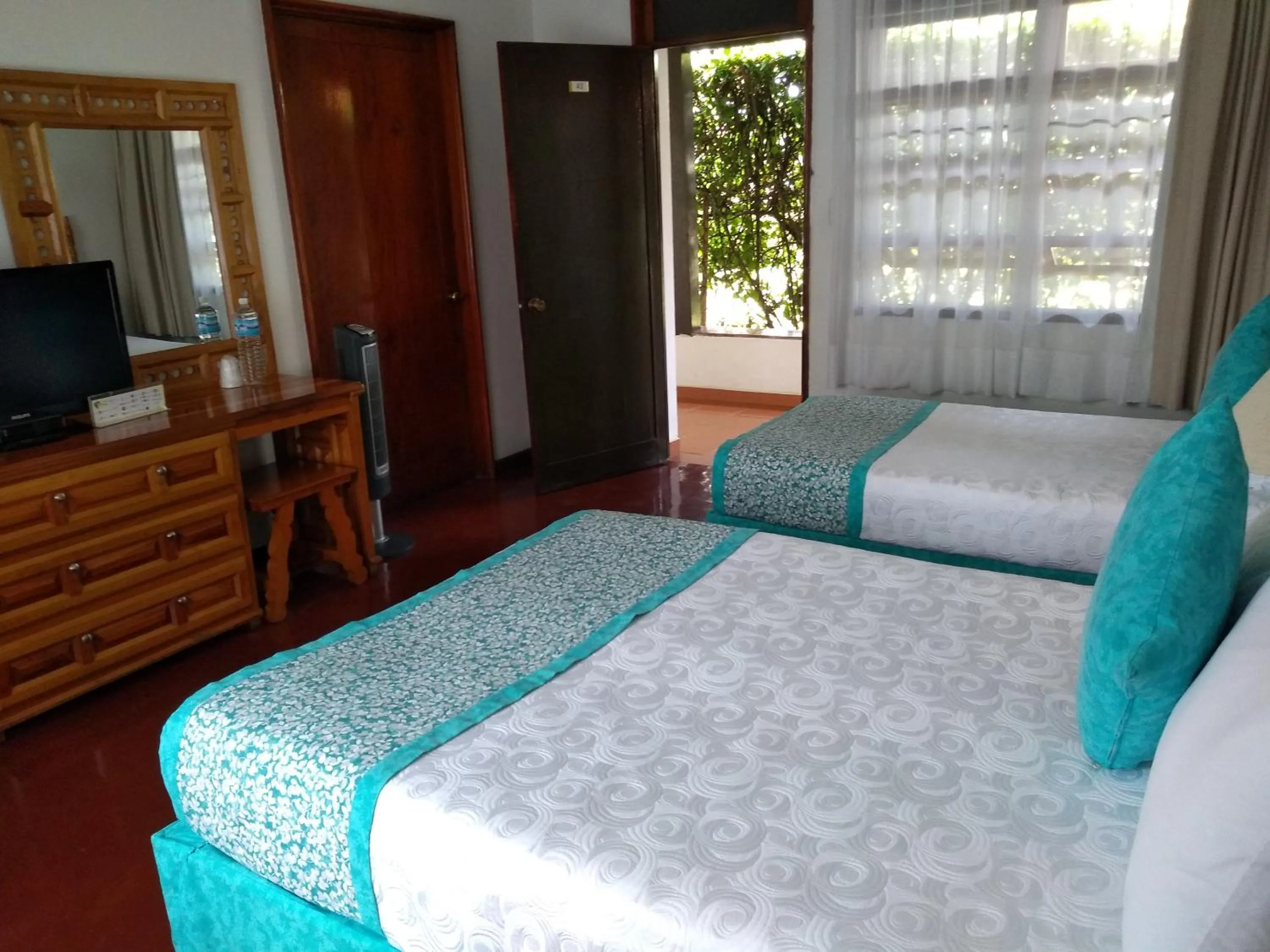 Bed in Hotel Posada Quinta Las Flores