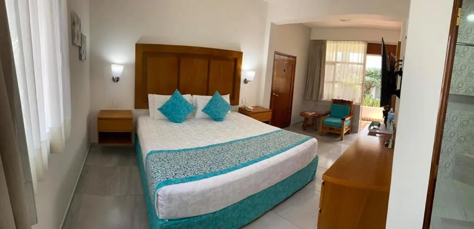 Bed in Hotel Posada Quinta Las Flores