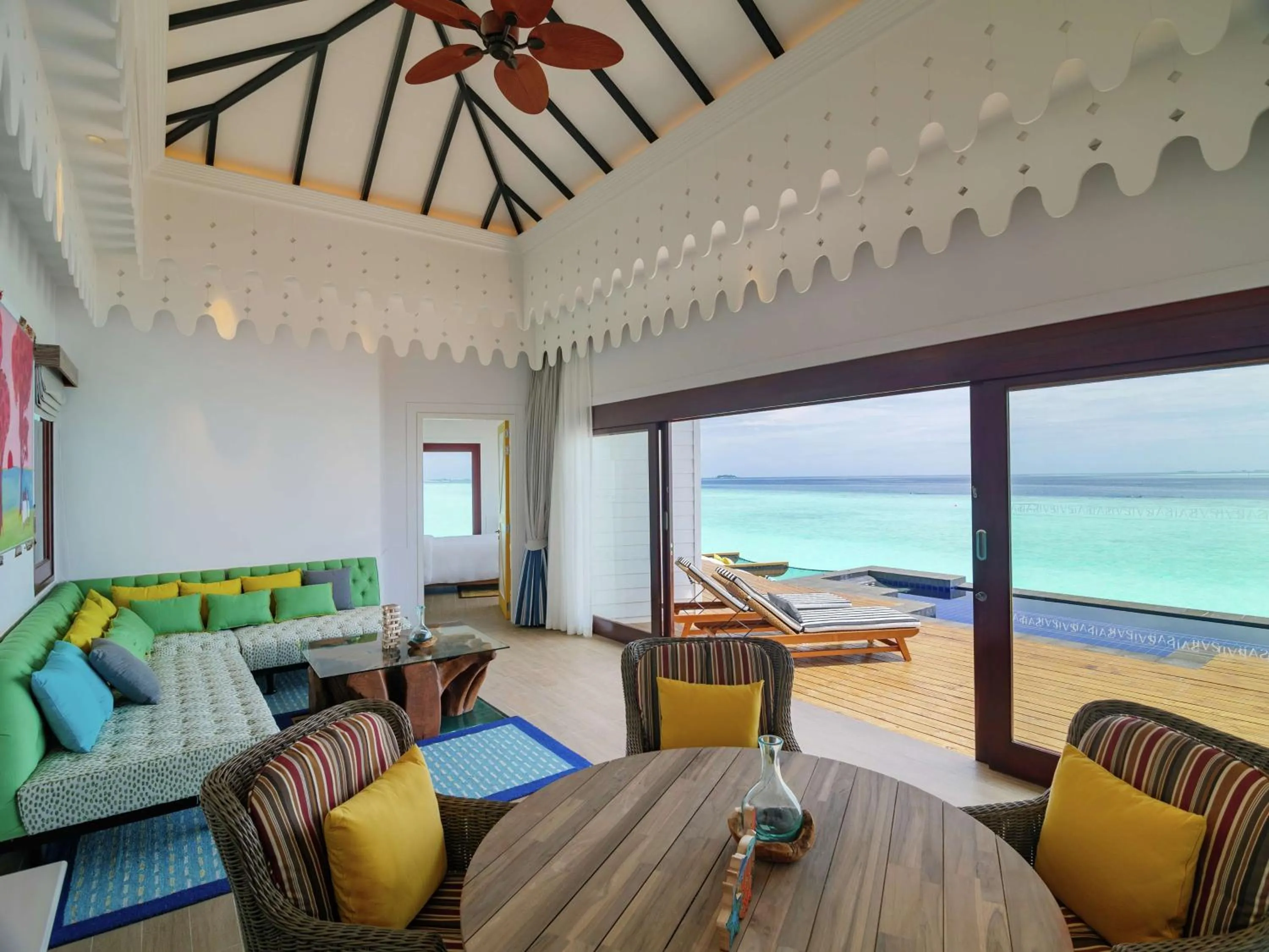 Communal lounge/ TV room in SAii Lagoon Maldives, Curio Collection By Hilton