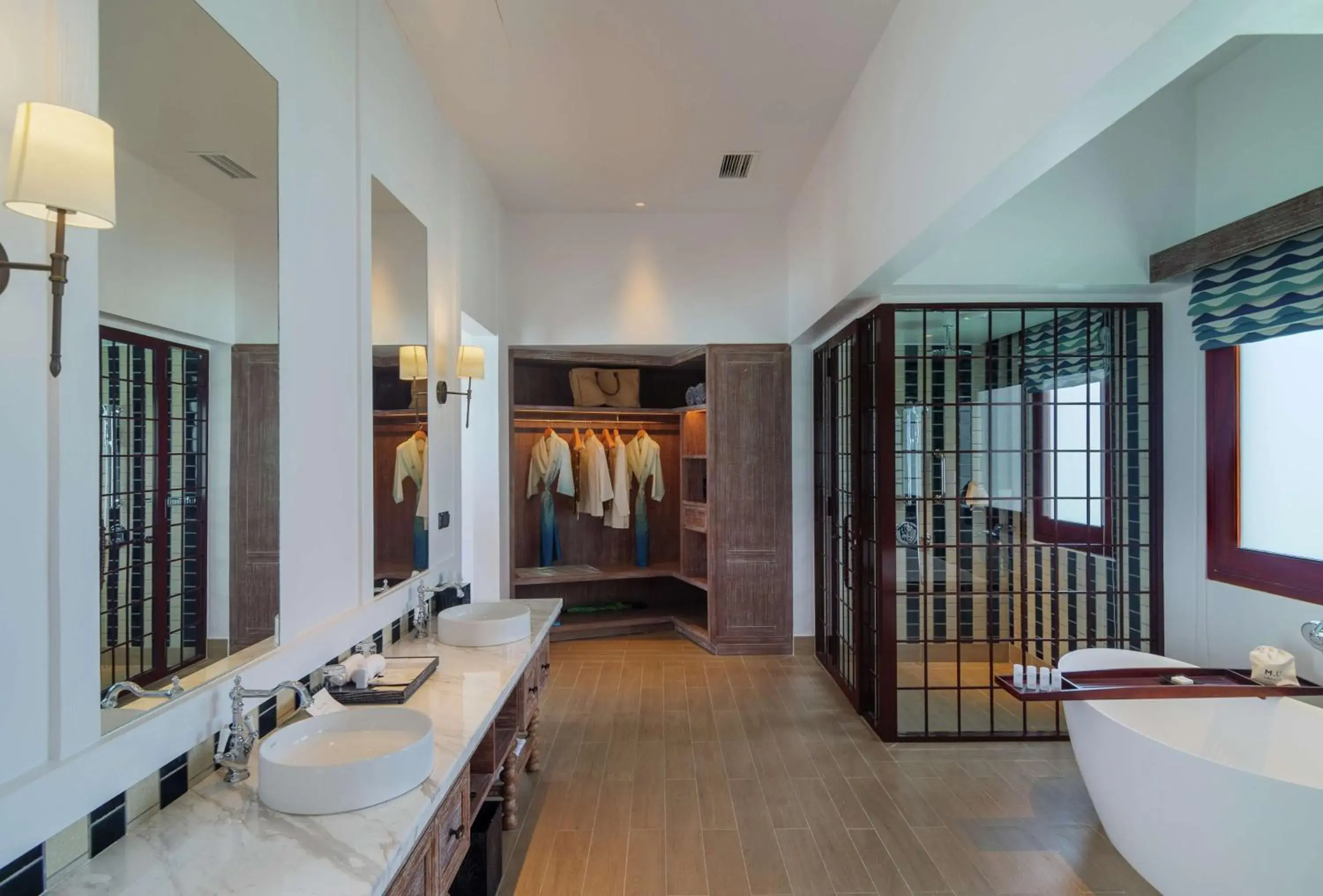 Bathroom, Bed in SAii Lagoon Maldives, Curio Collection By Hilton Bathroom, Bed in SAii Lagoon Maldives, Curio Collection By Hilton