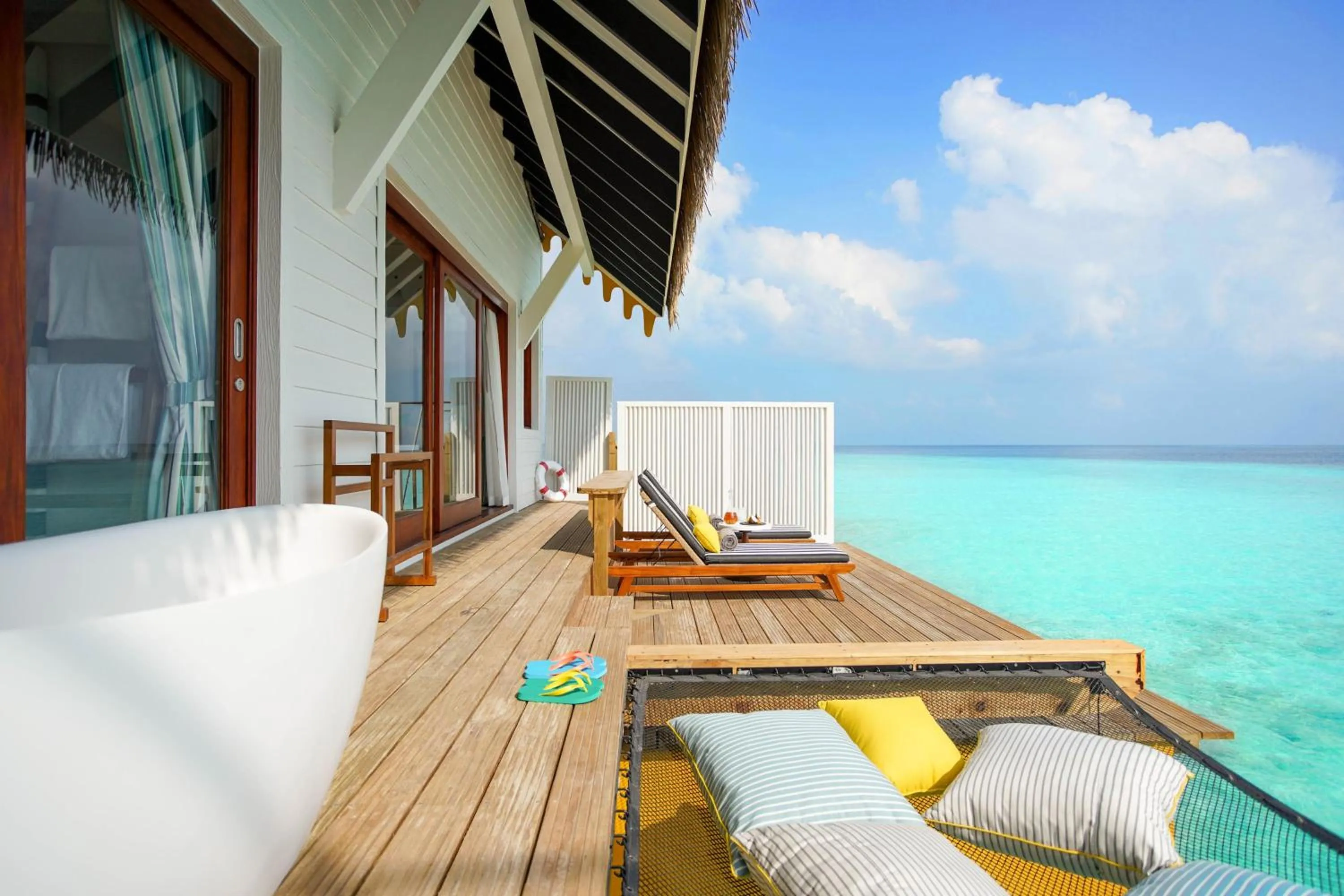 Patio in SAii Lagoon Maldives, Curio Collection By Hilton
