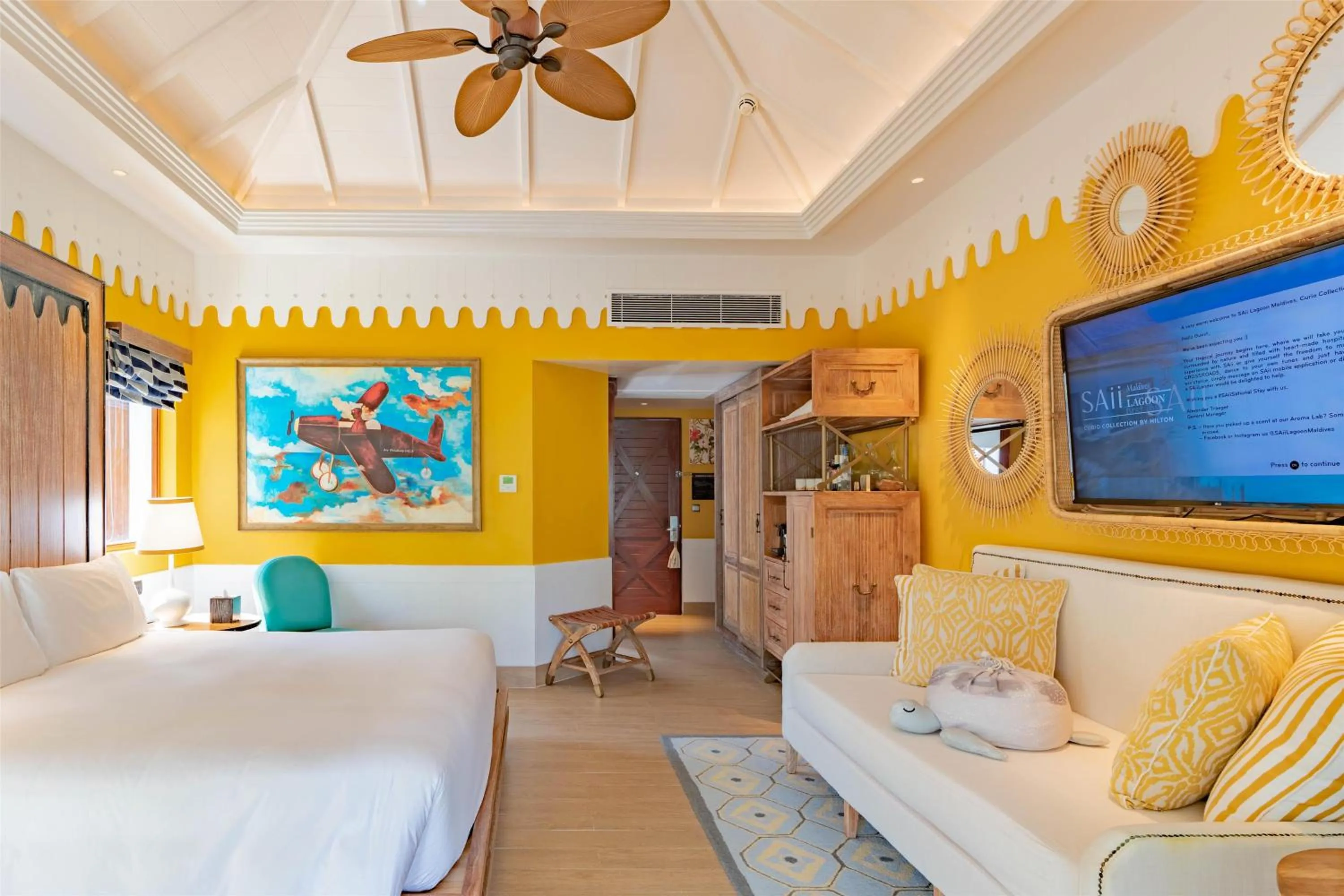 Living room, Bed in SAii Lagoon Maldives, Curio Collection By Hilton