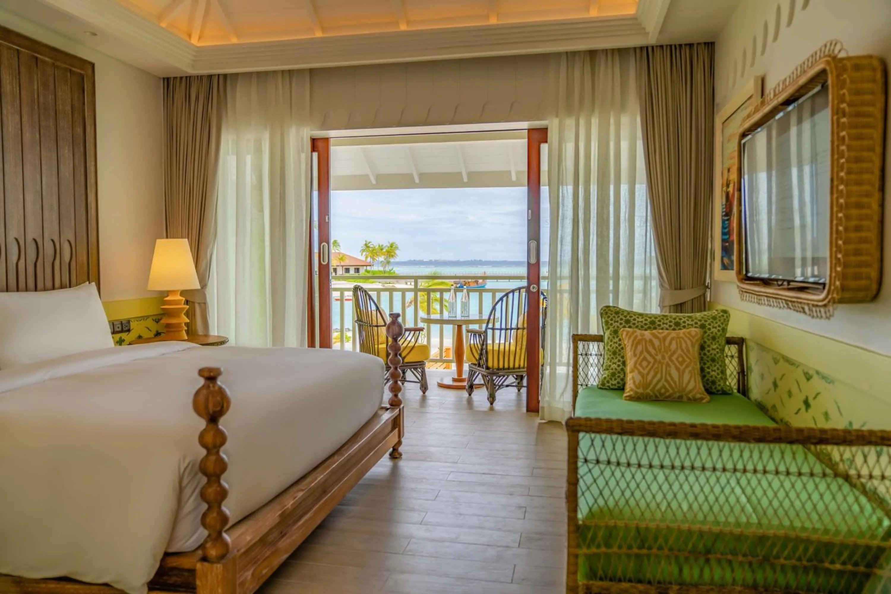 Living room, Bed in SAii Lagoon Maldives, Curio Collection By Hilton