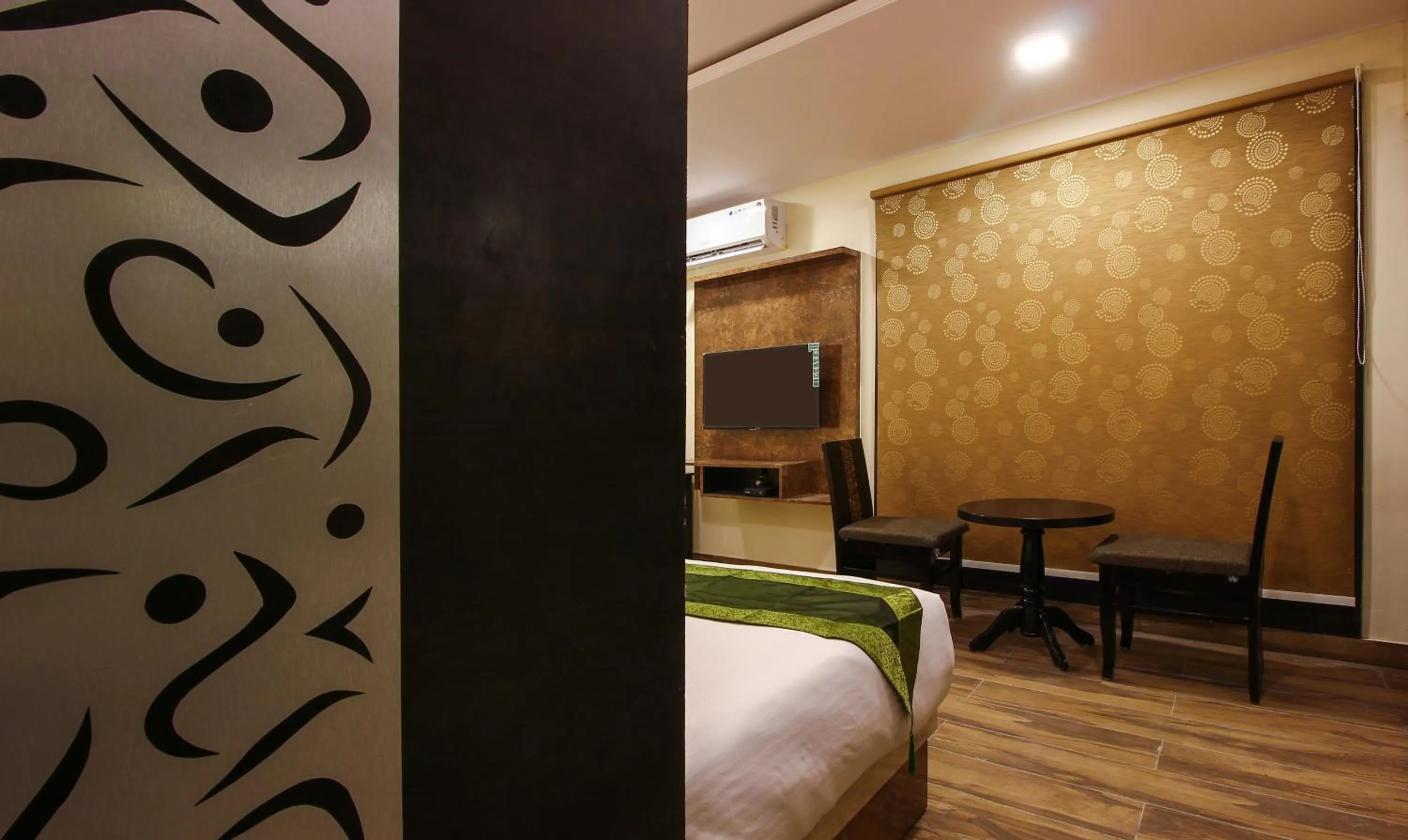 Seating area, Bed in Treebo Address Inn, Banjara Hills