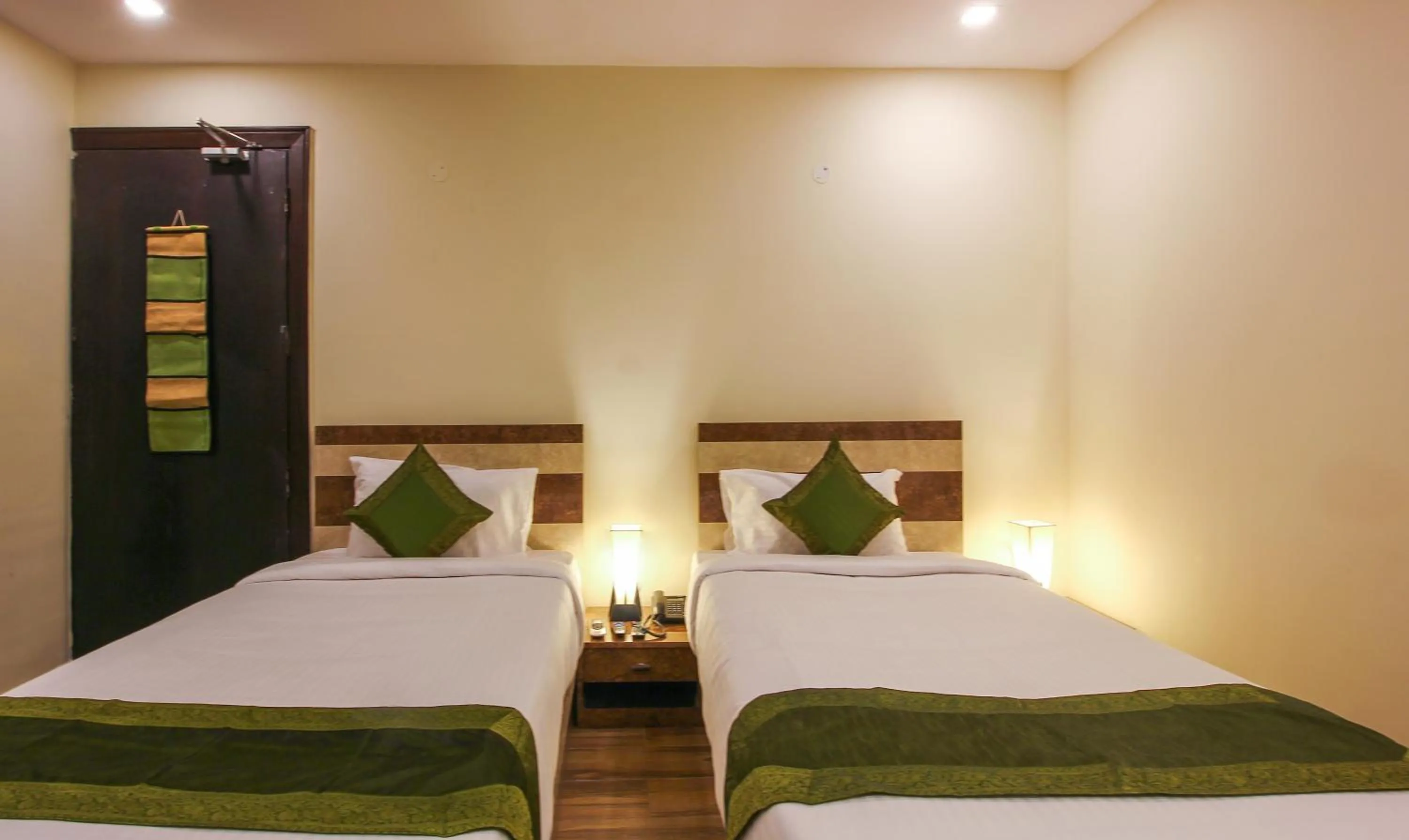 Bedroom, Bed in Treebo Address Inn, Banjara Hills
