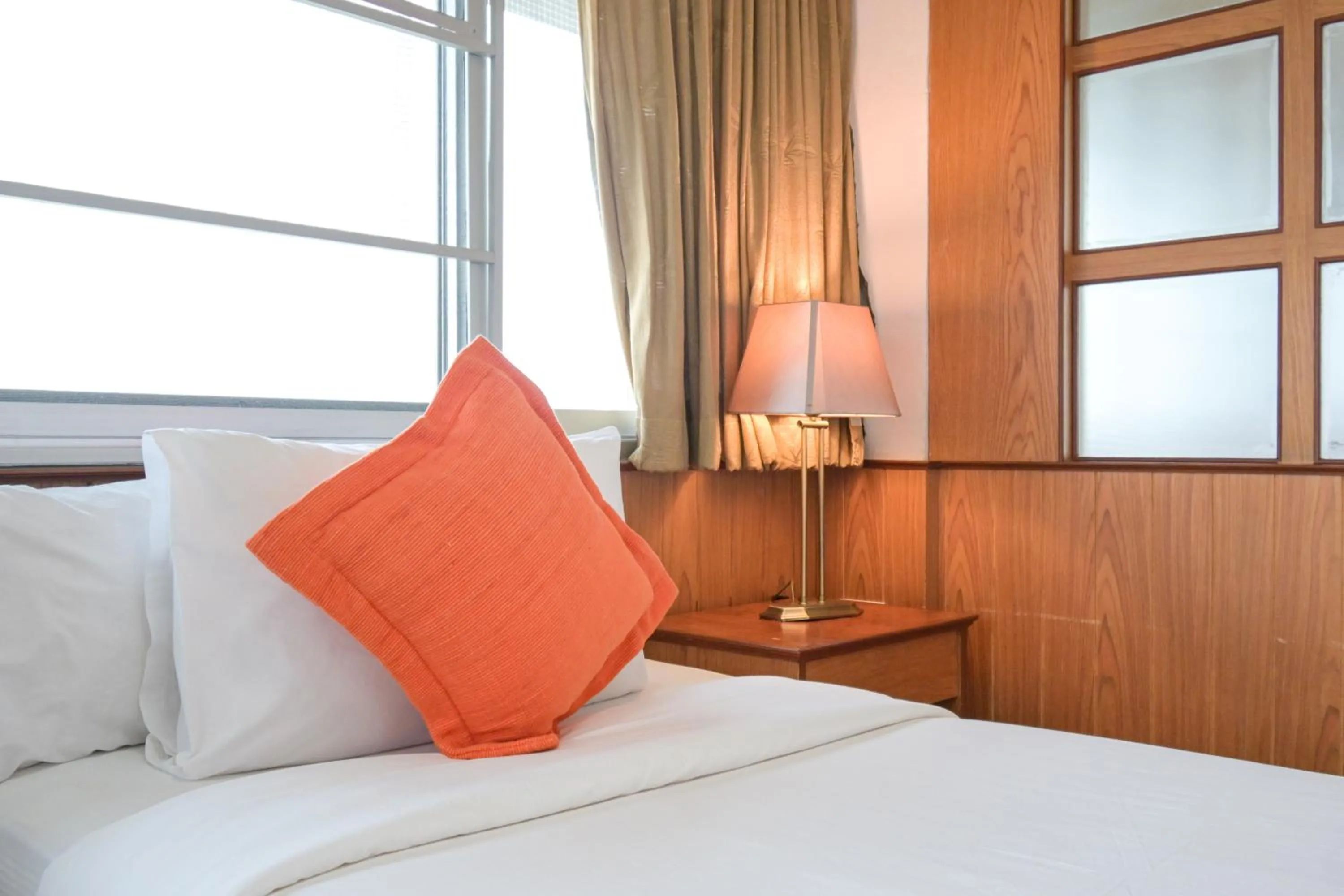 Bed in Rattana Park Hotel