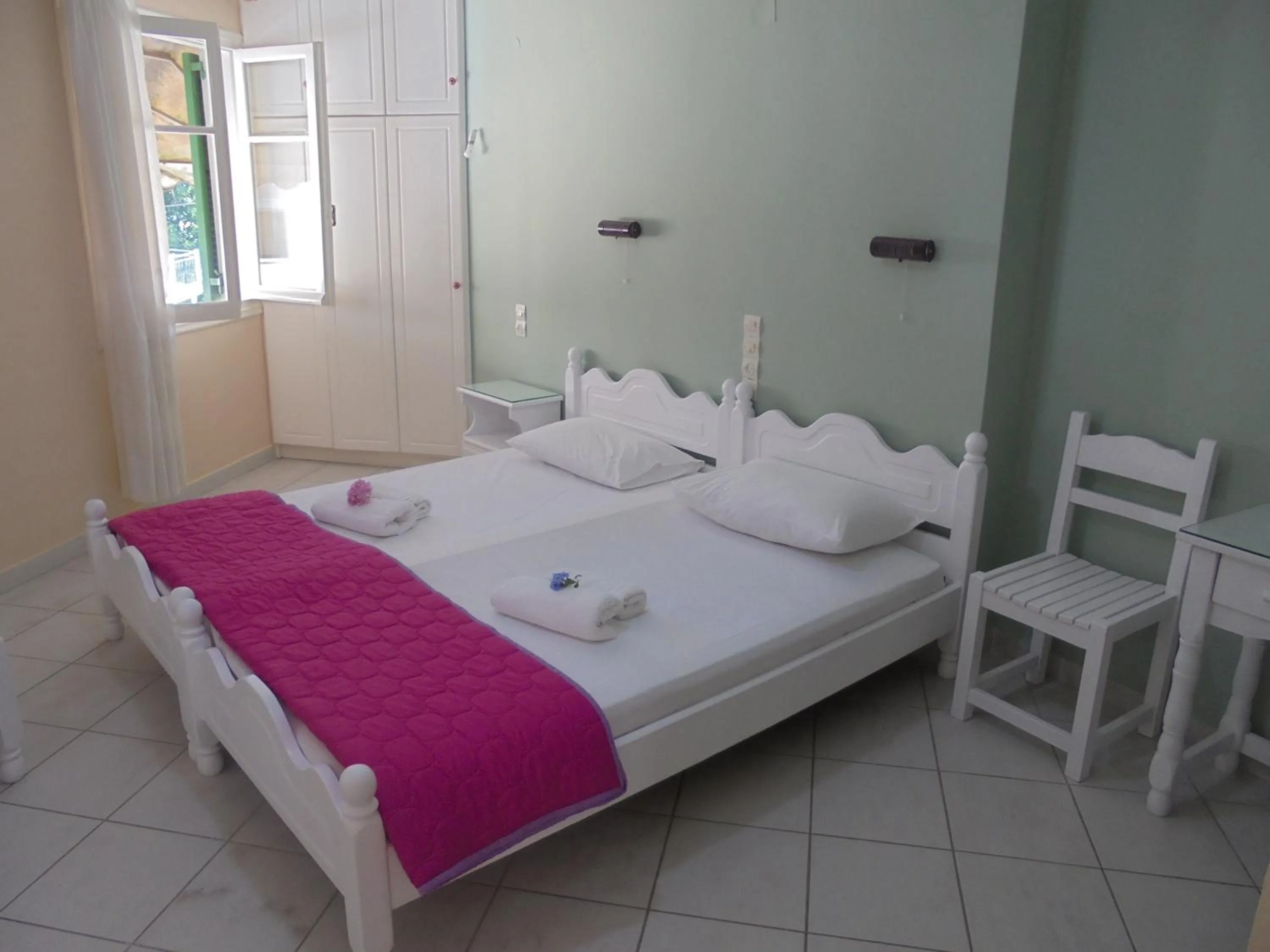 Bed in Georgakis George Rooms