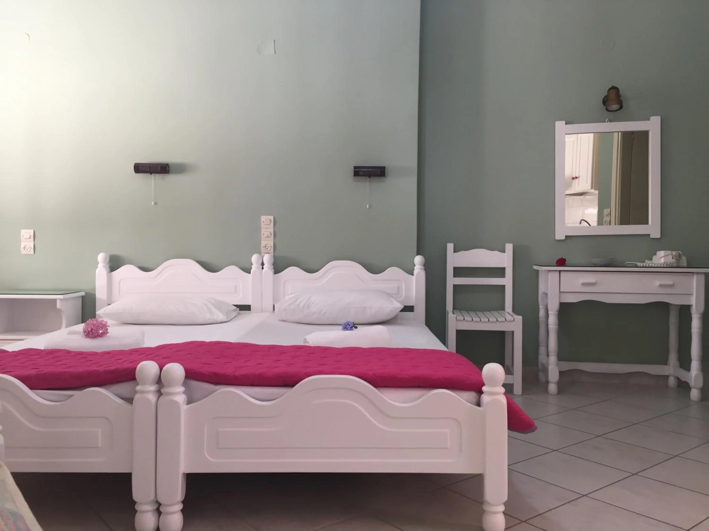Bed in Georgakis George Rooms