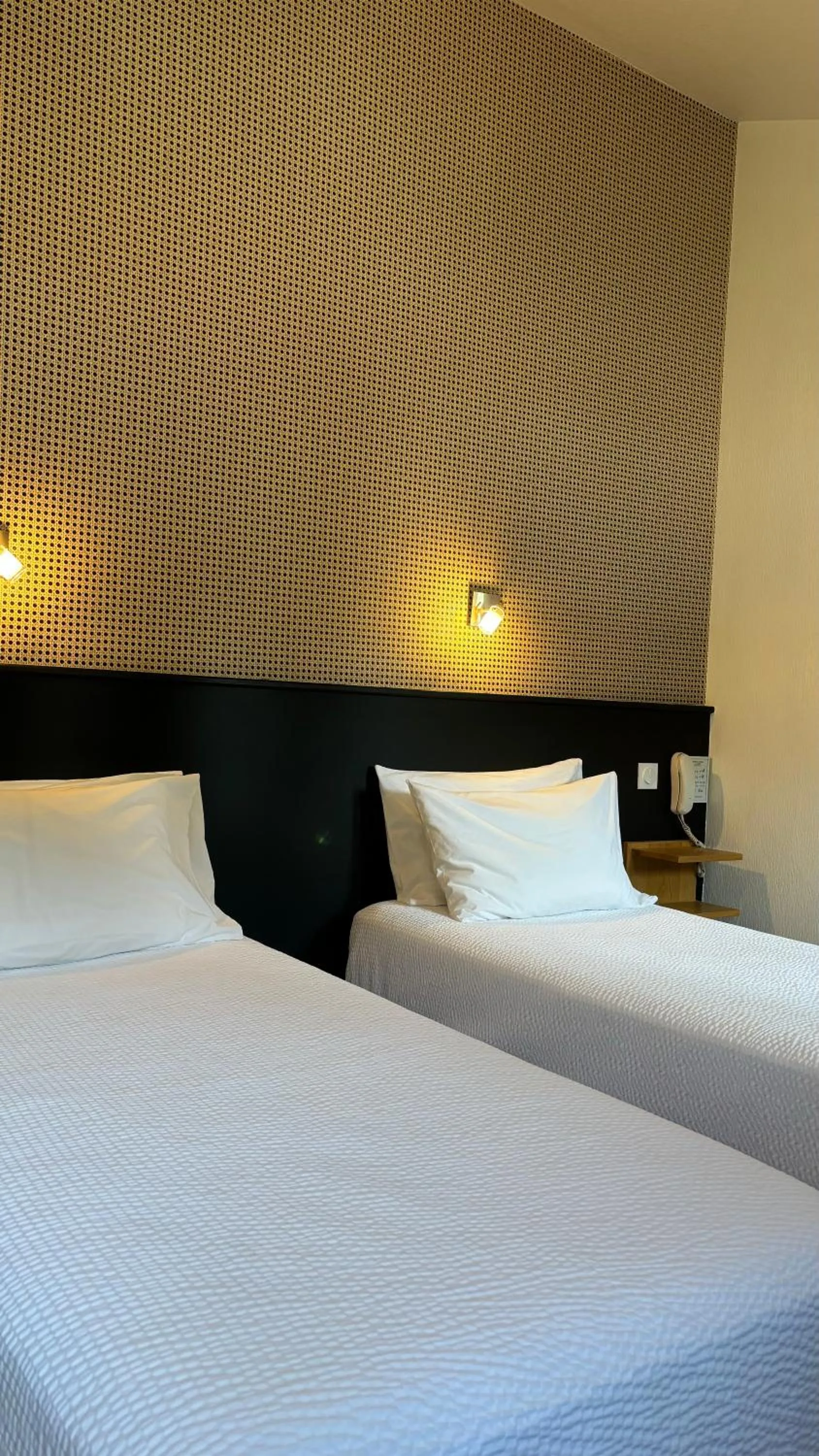 Photo of the whole room, Bed in Logis Hôtel Restaurant Grand Hôtel de Lyon