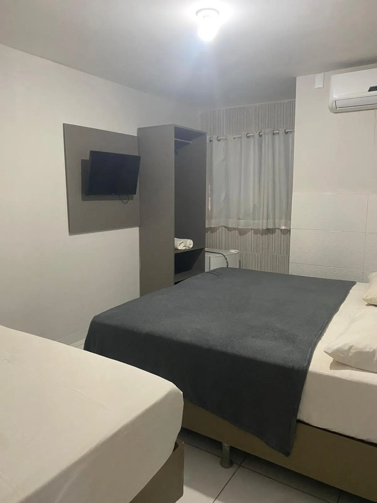 Bed in Pousada Tambaú