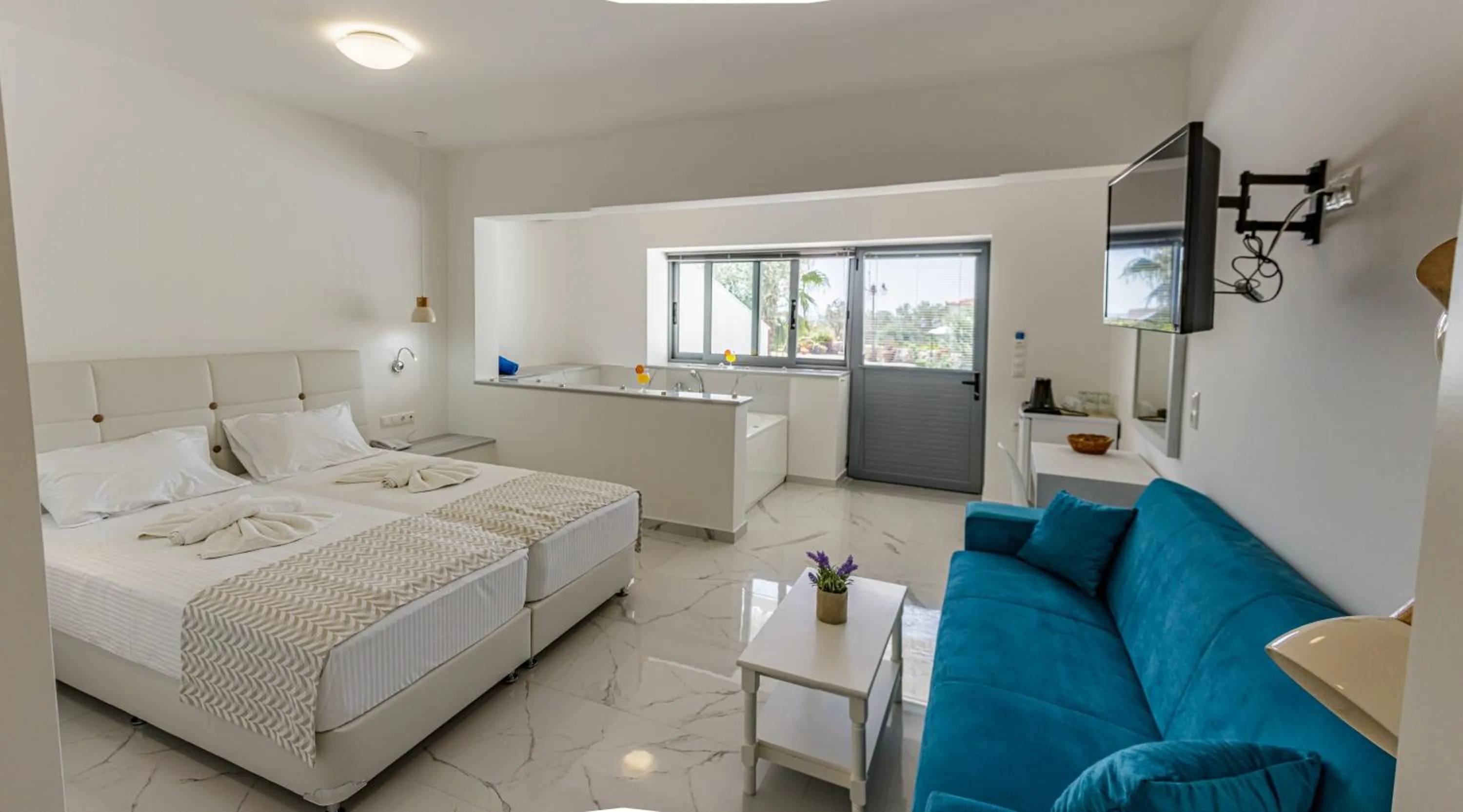 Bed in Limnionas Bay Village Hotel