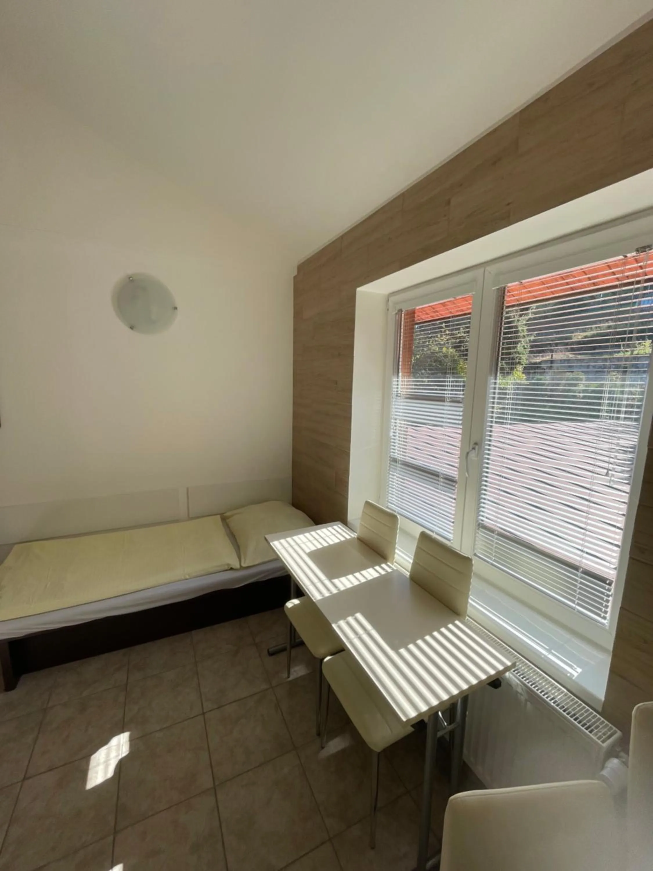 Living room, Bed in Hotel Prom