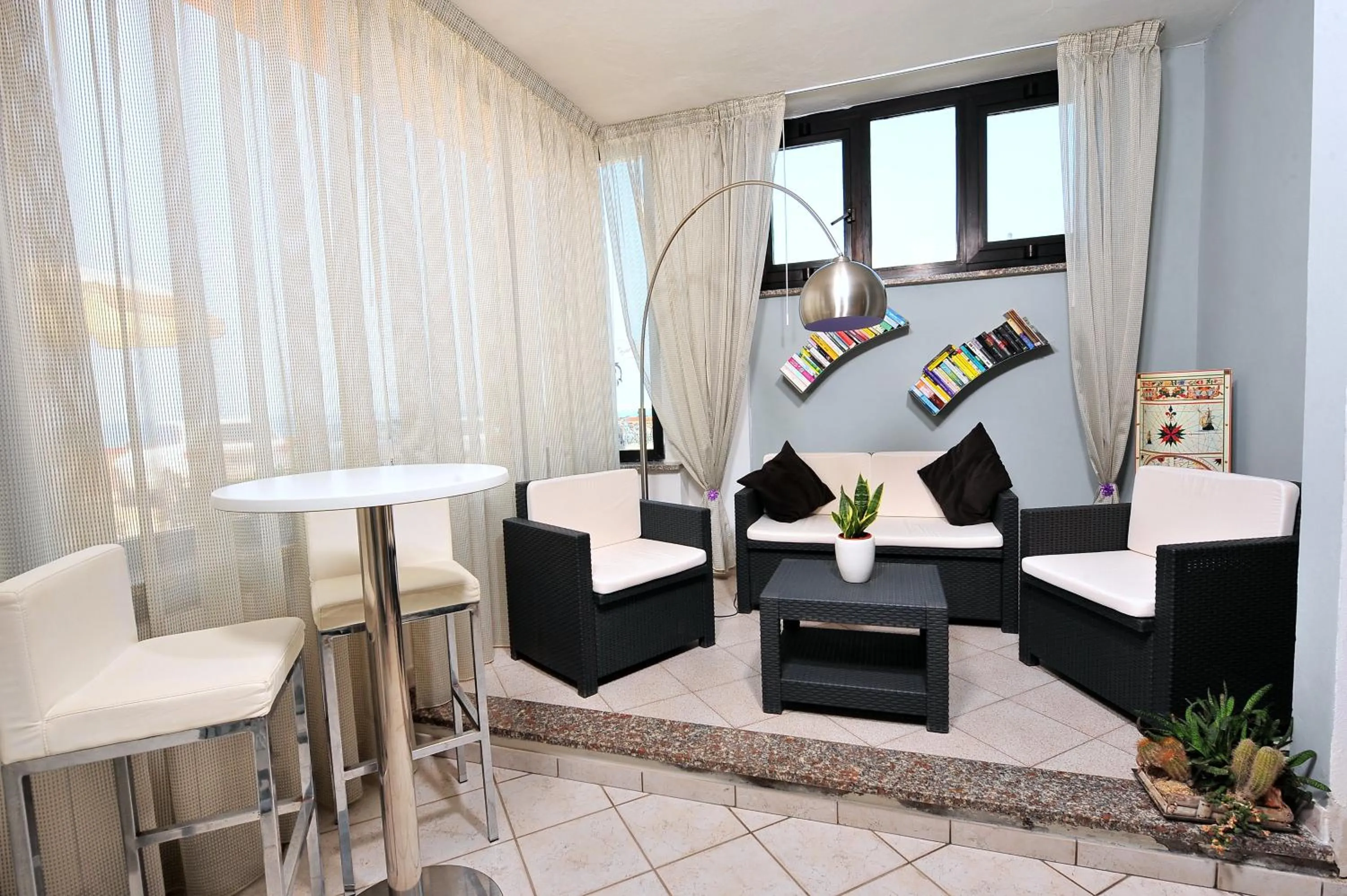 Communal lounge/ TV room in Hotel il Delfino