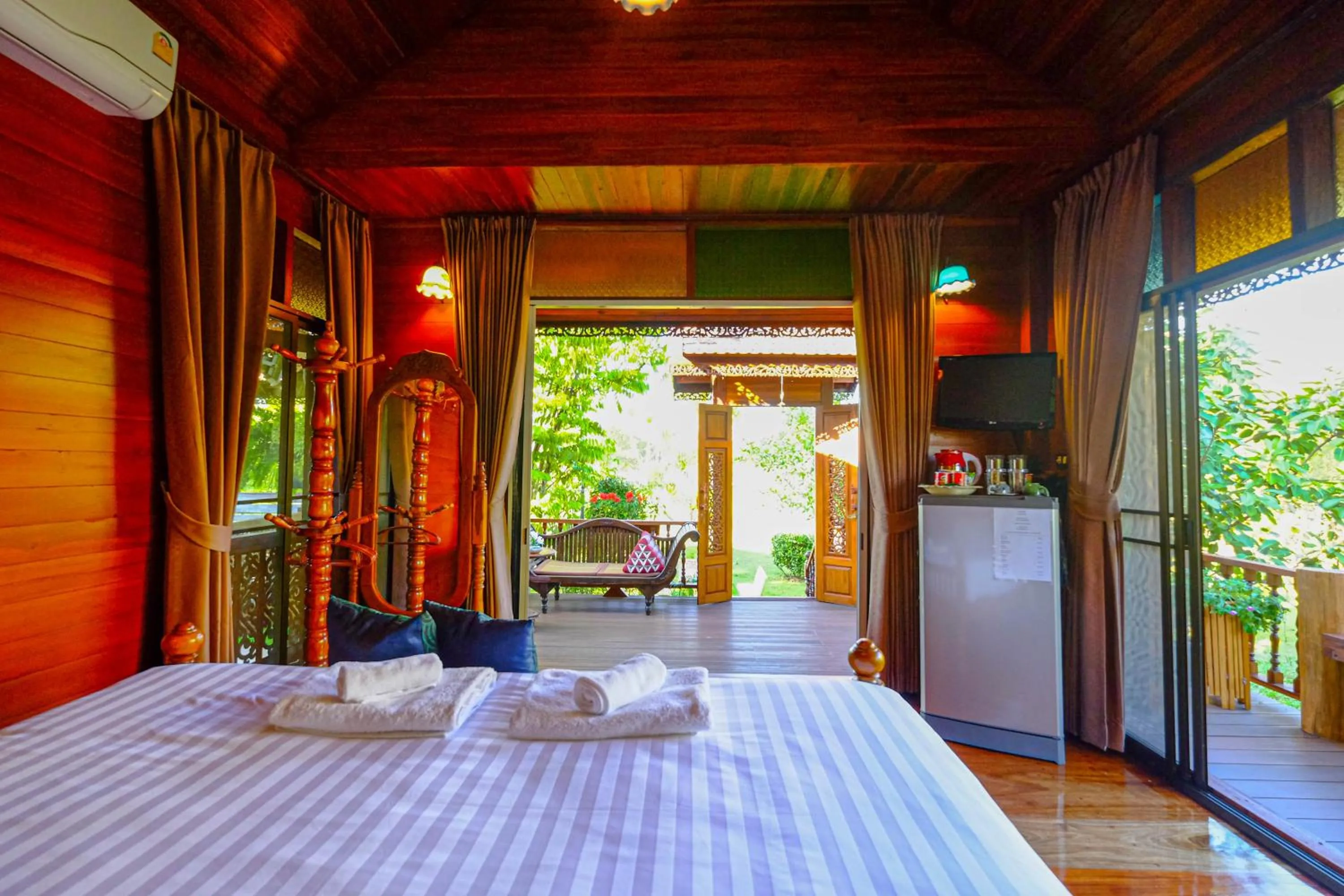 Bed in Rommai Villa Chiang Rai