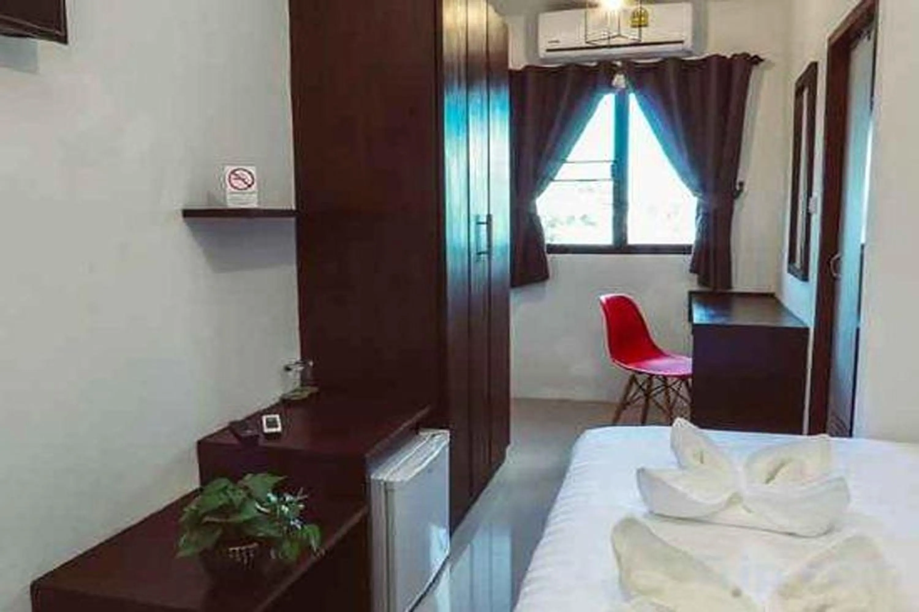 Bed in Hotel Wualai by CMStay