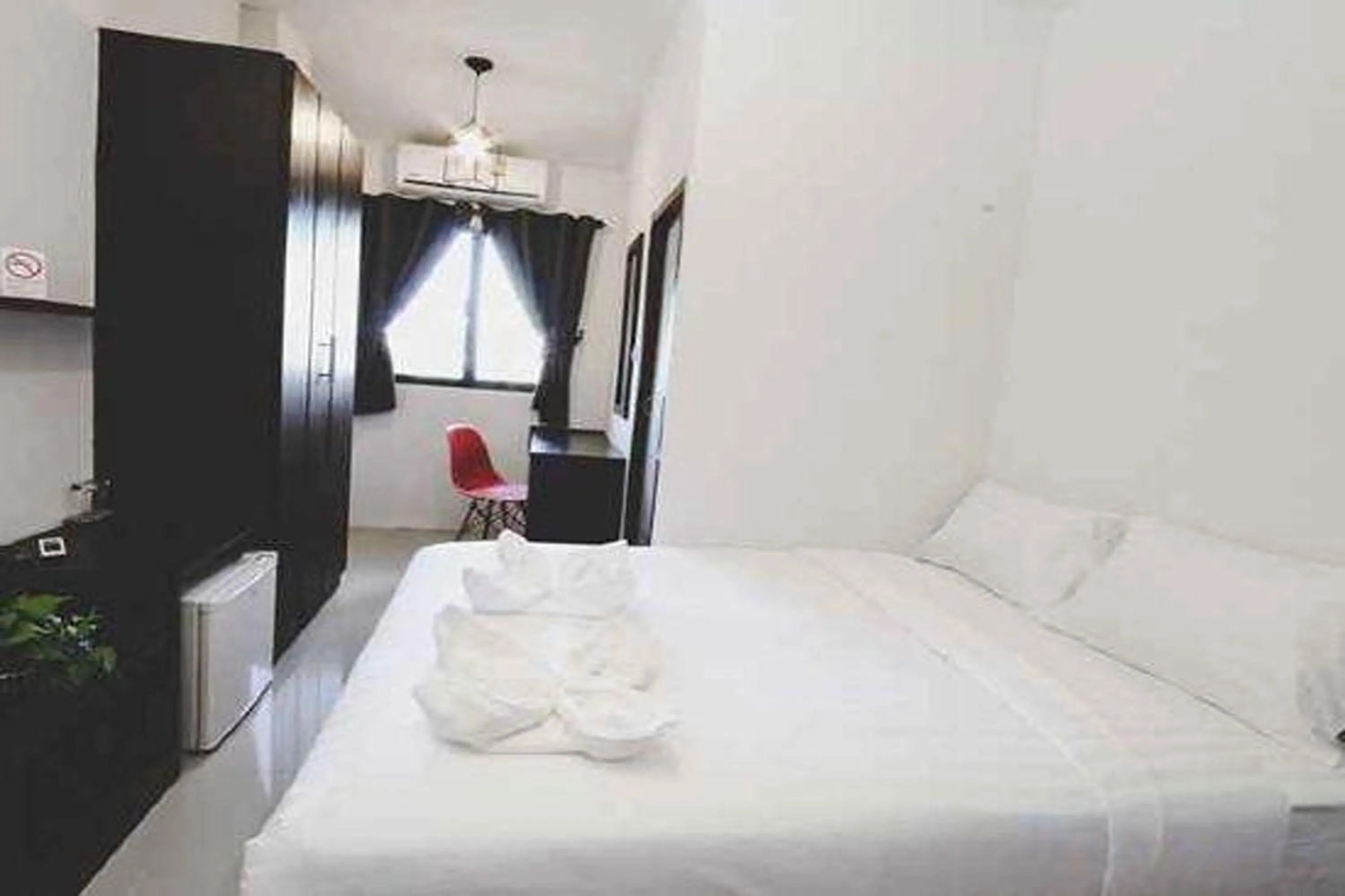 Bed in Hotel Wualai by CMStay