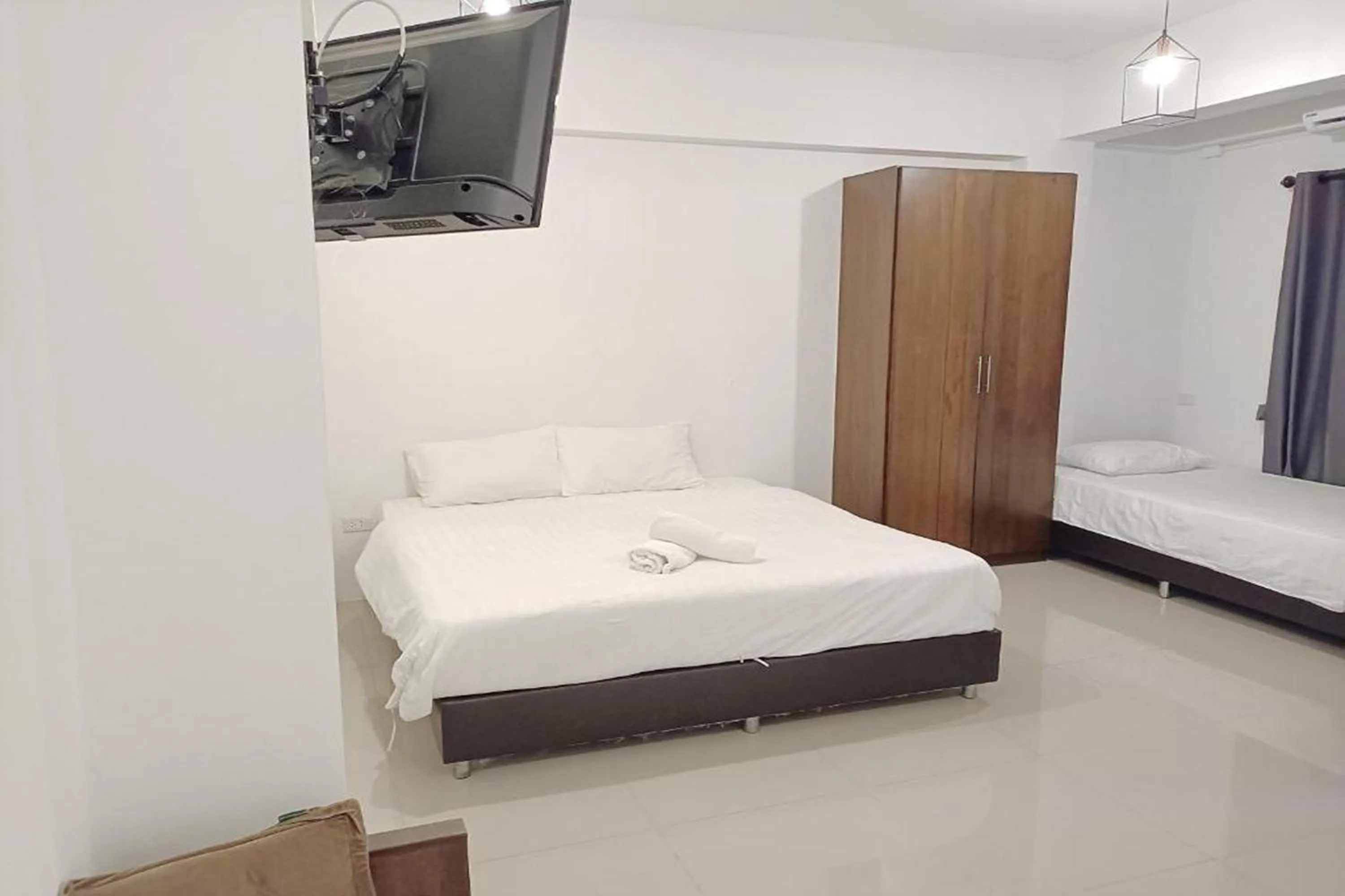 Bed in Hotel Wualai by CMStay