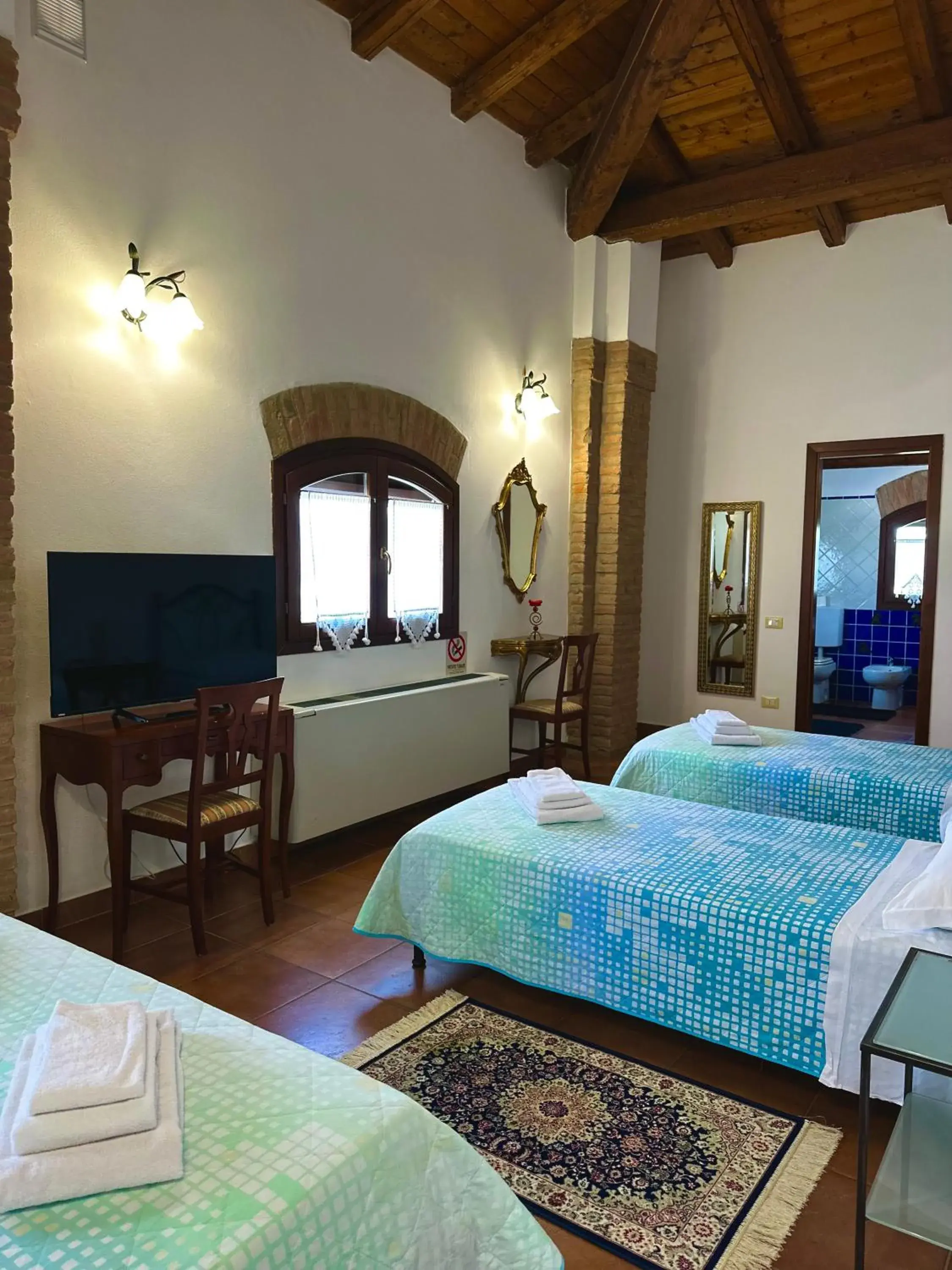 Quadruple Room with Private Bathroom in Agriturismo Sabidor Quadruple Room with Private Bathroom in Agriturismo Sabidor