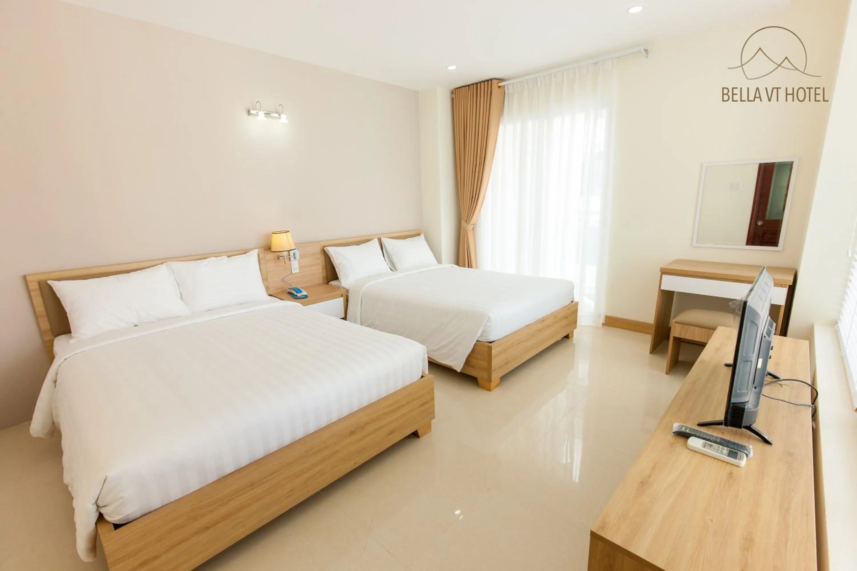 Bed in BELLA VT HOTEL