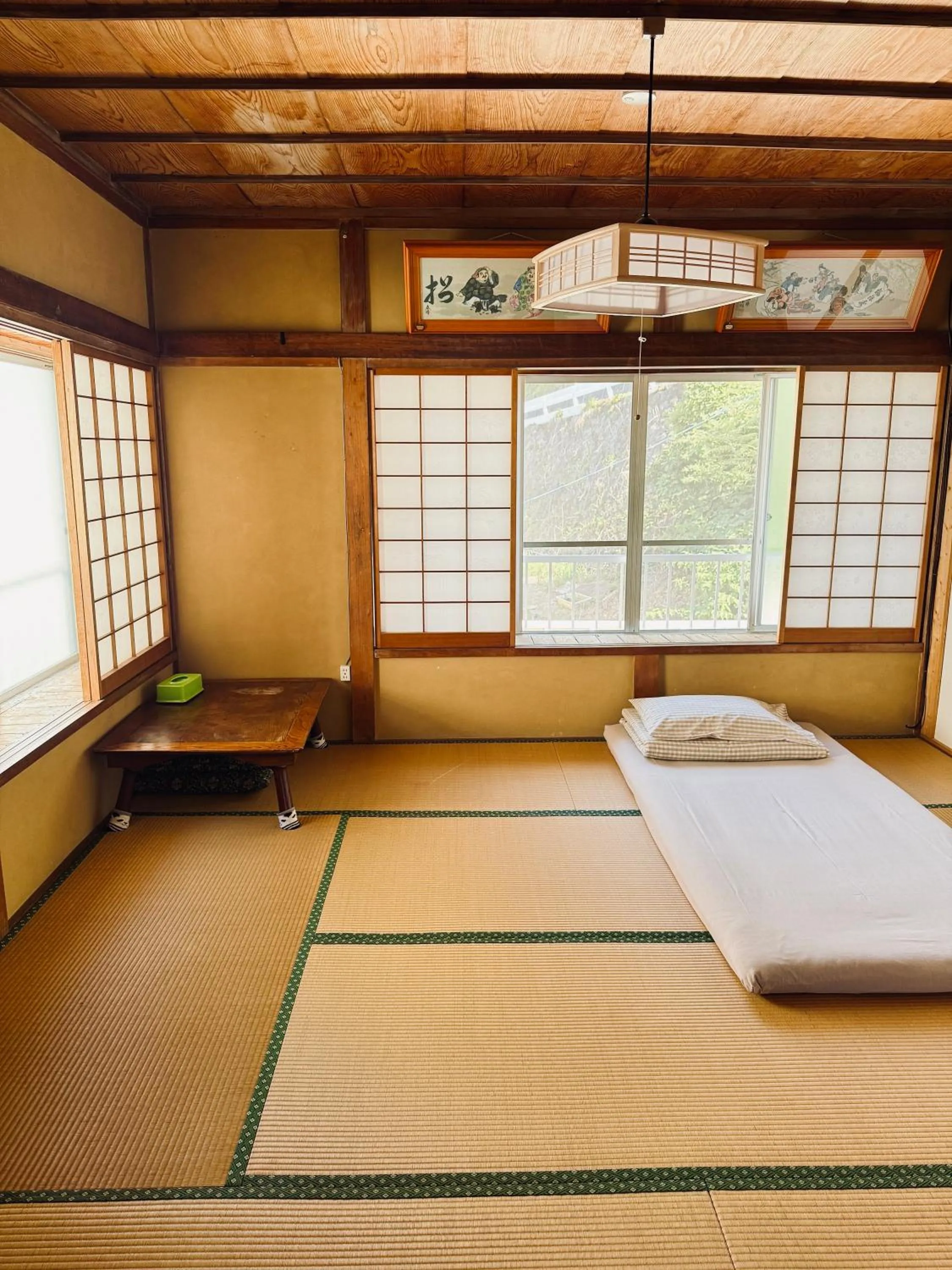 Bed in Izu Hokkawa Seaside Guesthouse 伊豆北川の家