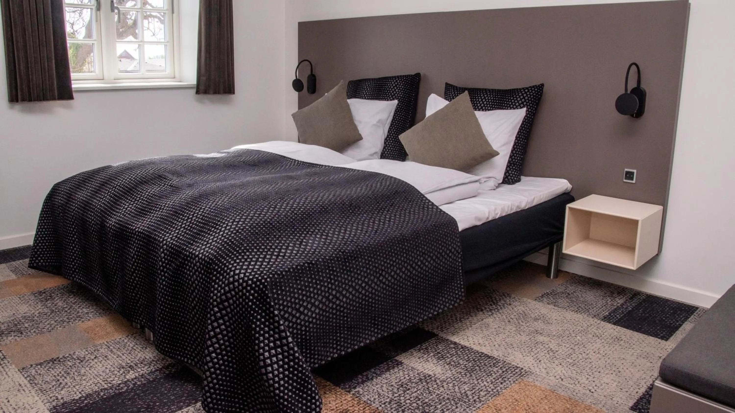 Bed in Hotel Skivehus