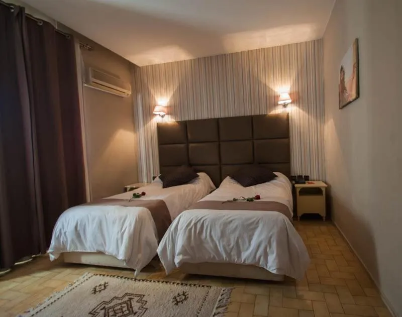 Bed in Hotel De La Paix