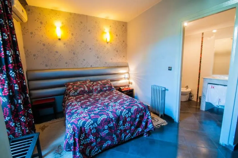 Bed in Hotel De La Paix