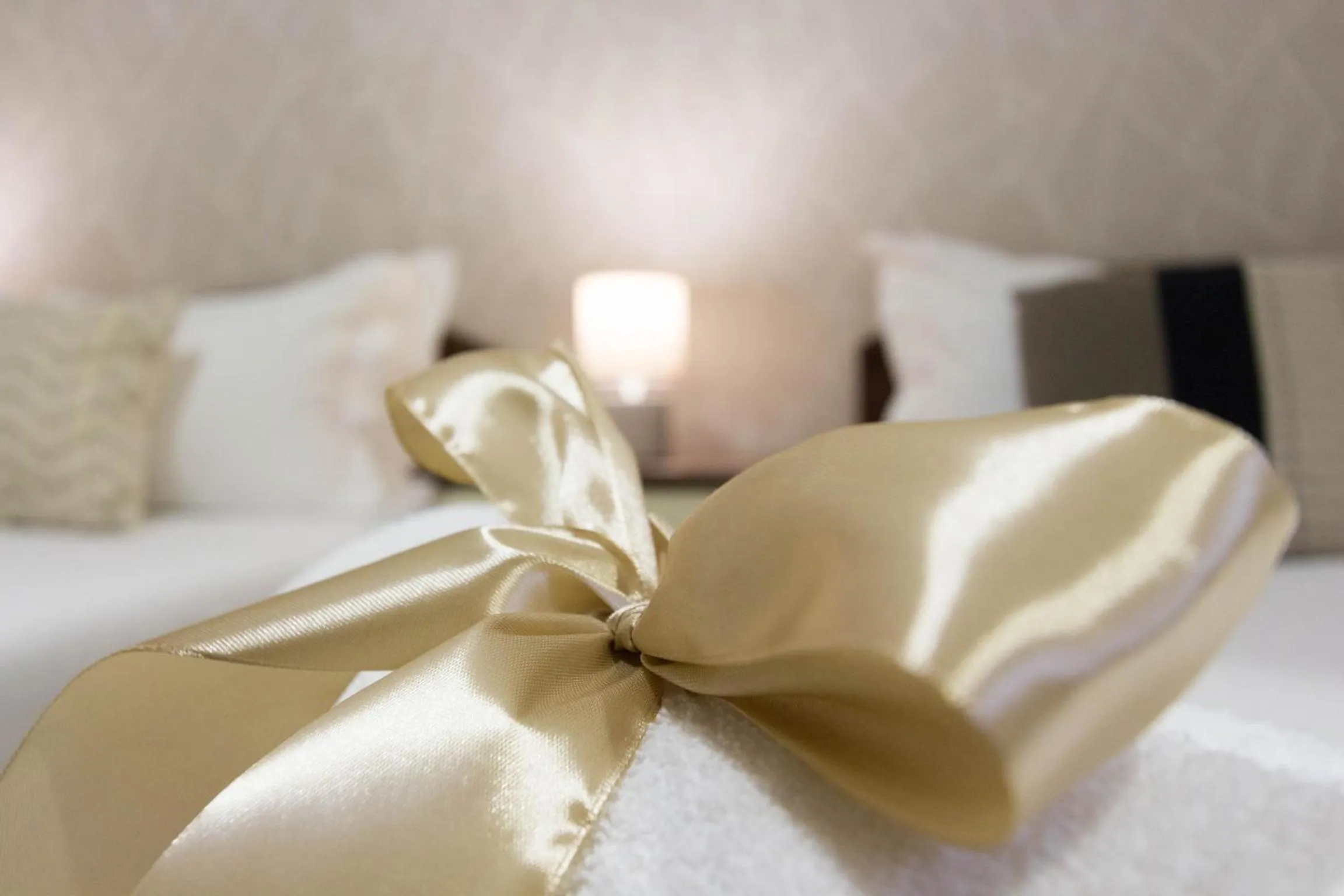 Bed in Arcobaleno Rooms