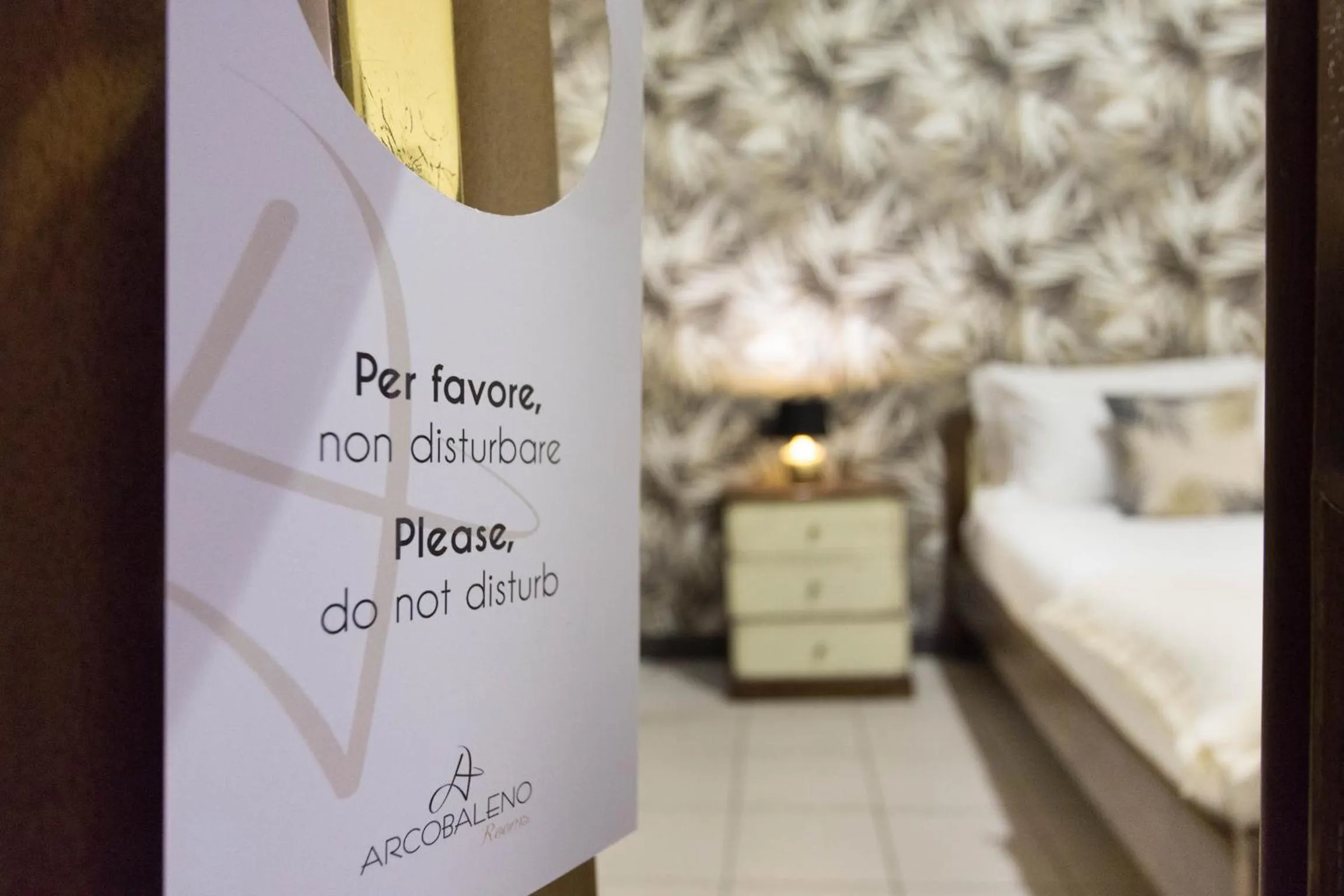 Bed in Arcobaleno Rooms