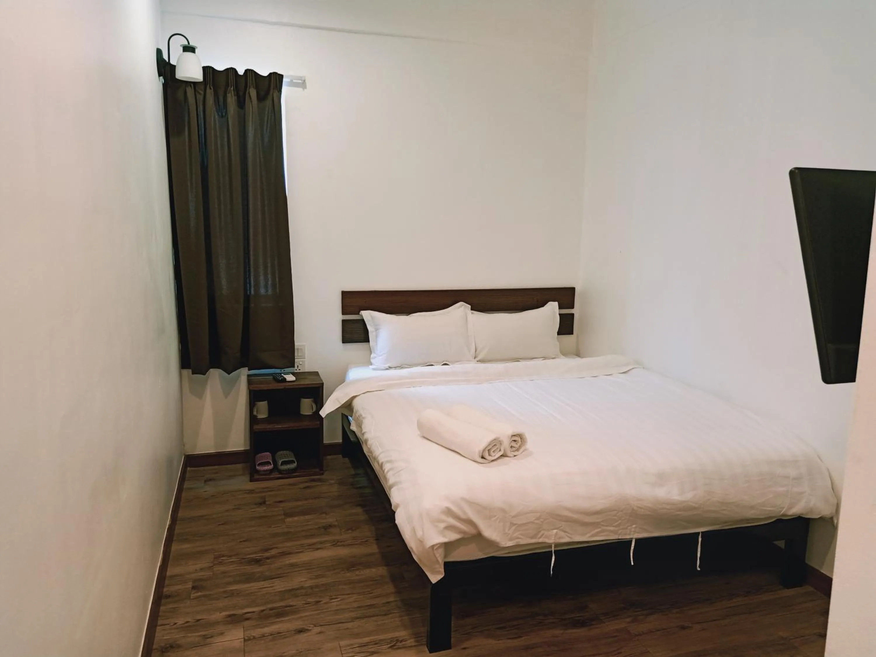 Bed in Cozy Riverside Hotel