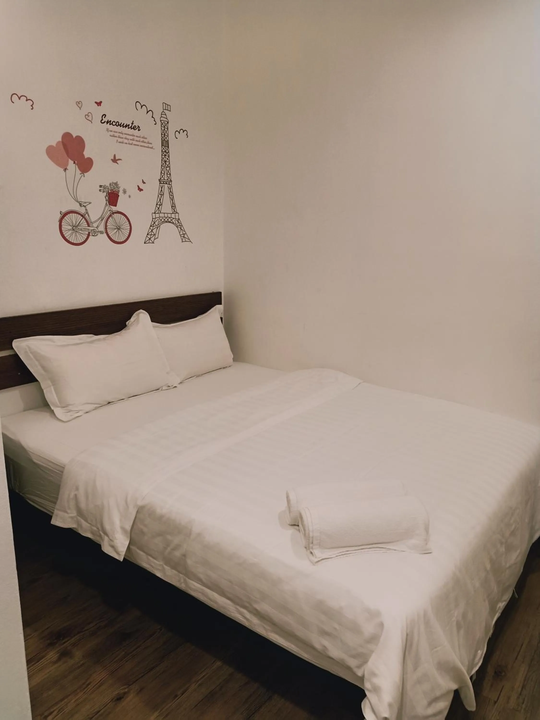 Bed in Cozy Riverside Hotel