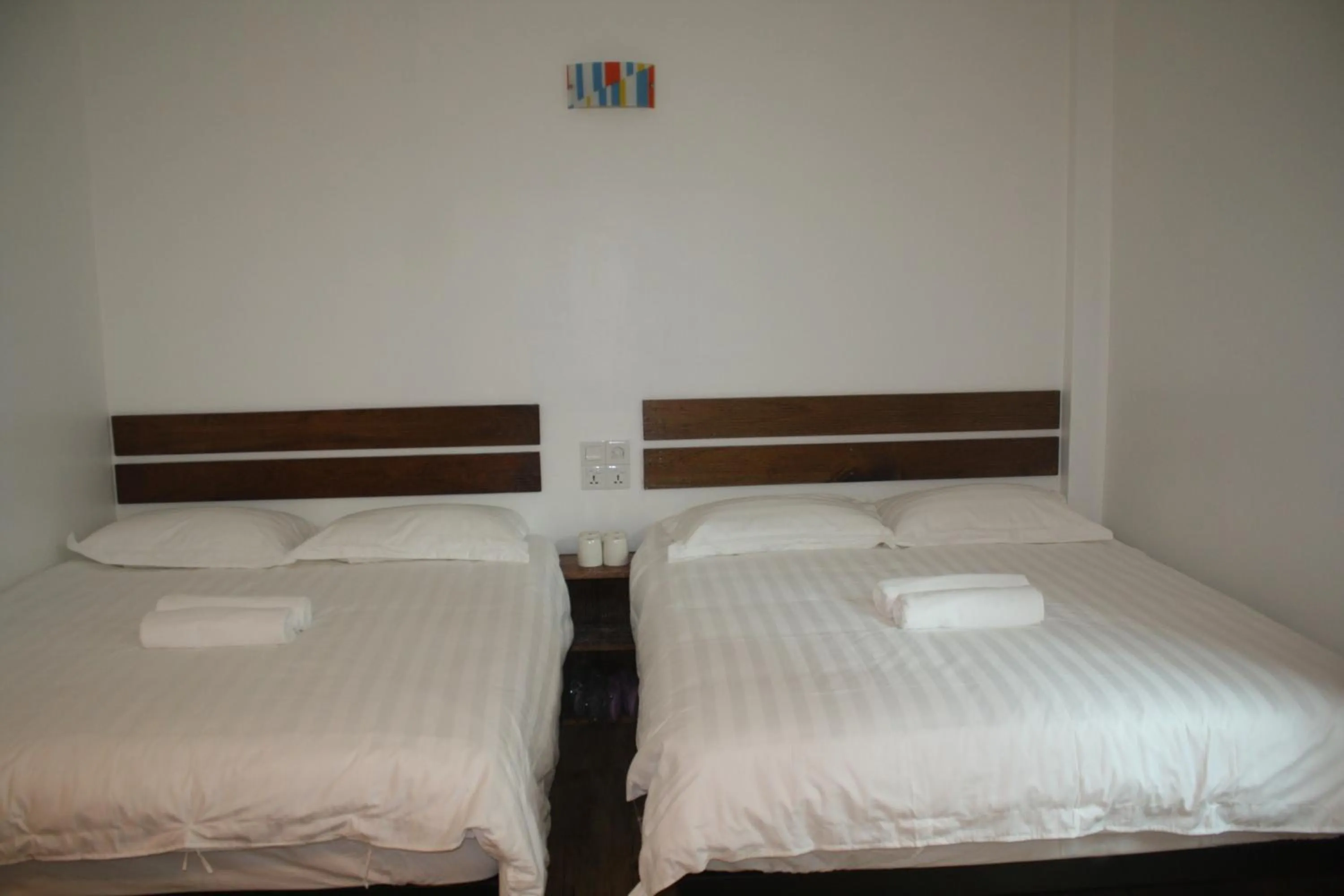 Bed in Cozy Riverside Hotel