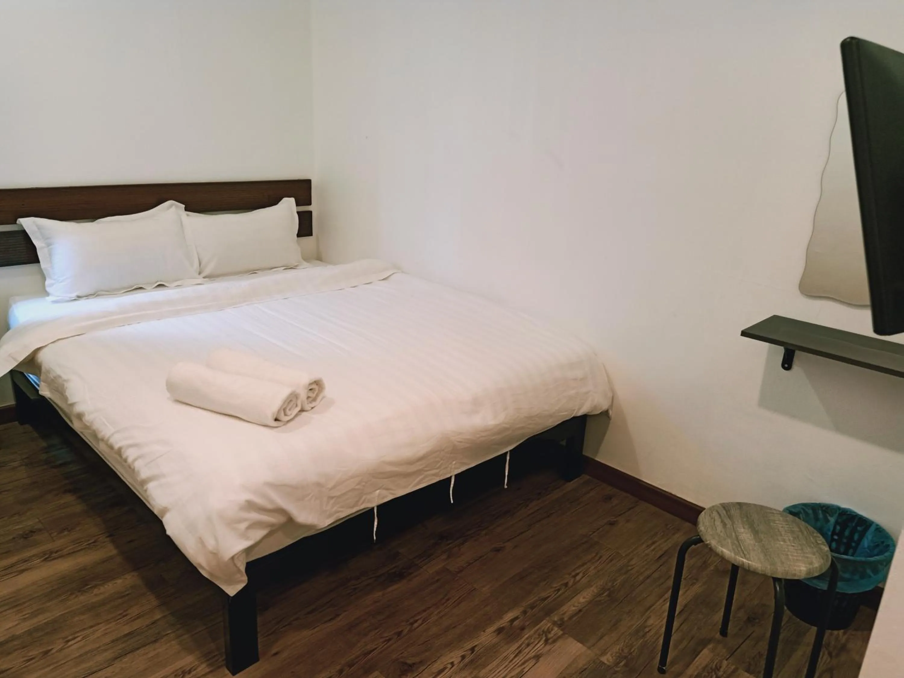 Bed in Cozy Riverside Hotel