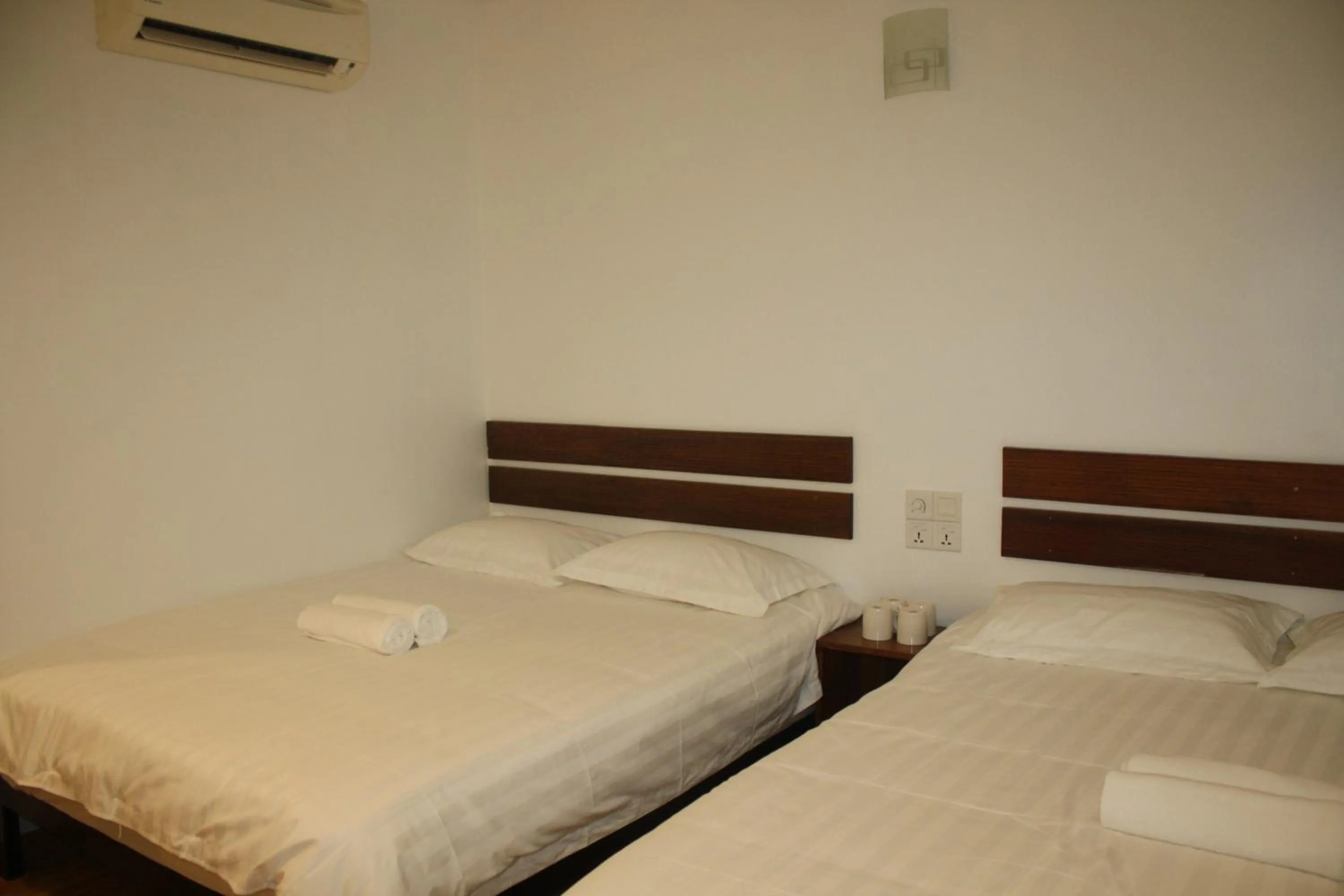 Bed in Cozy Riverside Hotel
