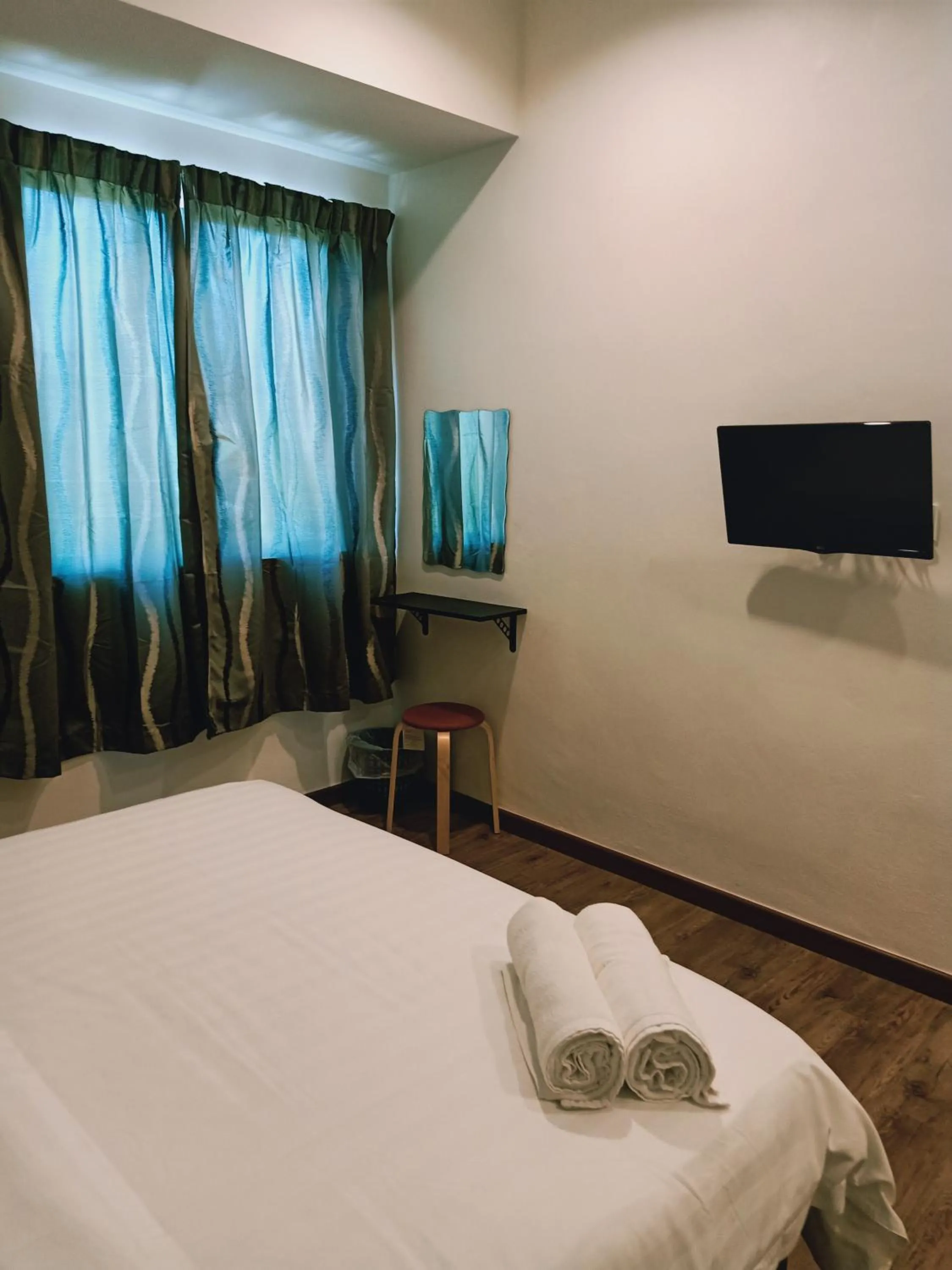 Bed in Cozy Riverside Hotel