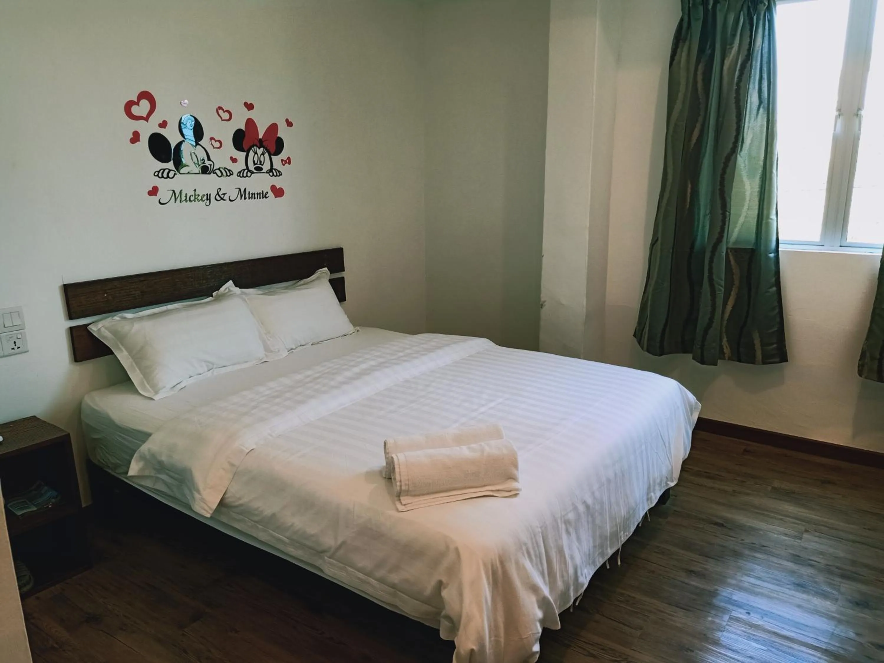 Bed in Cozy Riverside Hotel